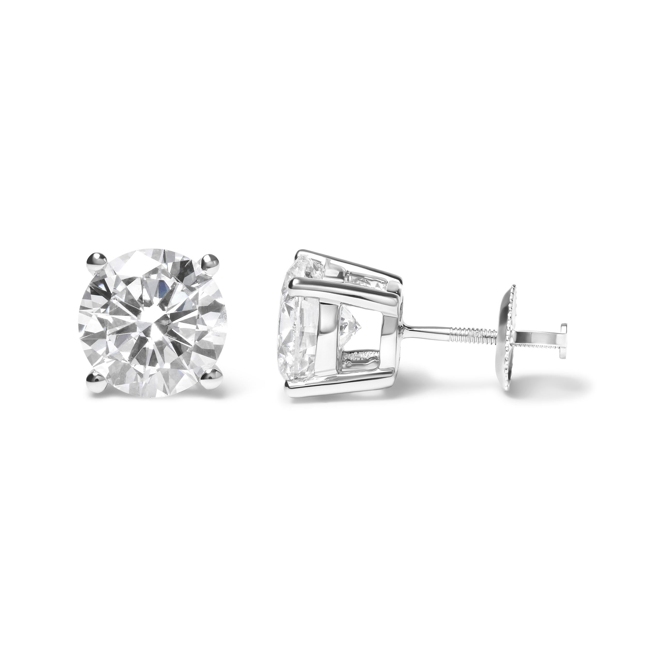 Crafted for the connoisseur of luxury, these exquisite stud earrings exude timeless elegance. Two resplendent, GIA-certified diamonds, each weighing a remarkable 3 carats, are the crowning glory of this pair. These round brilliant-cut gems dazzle