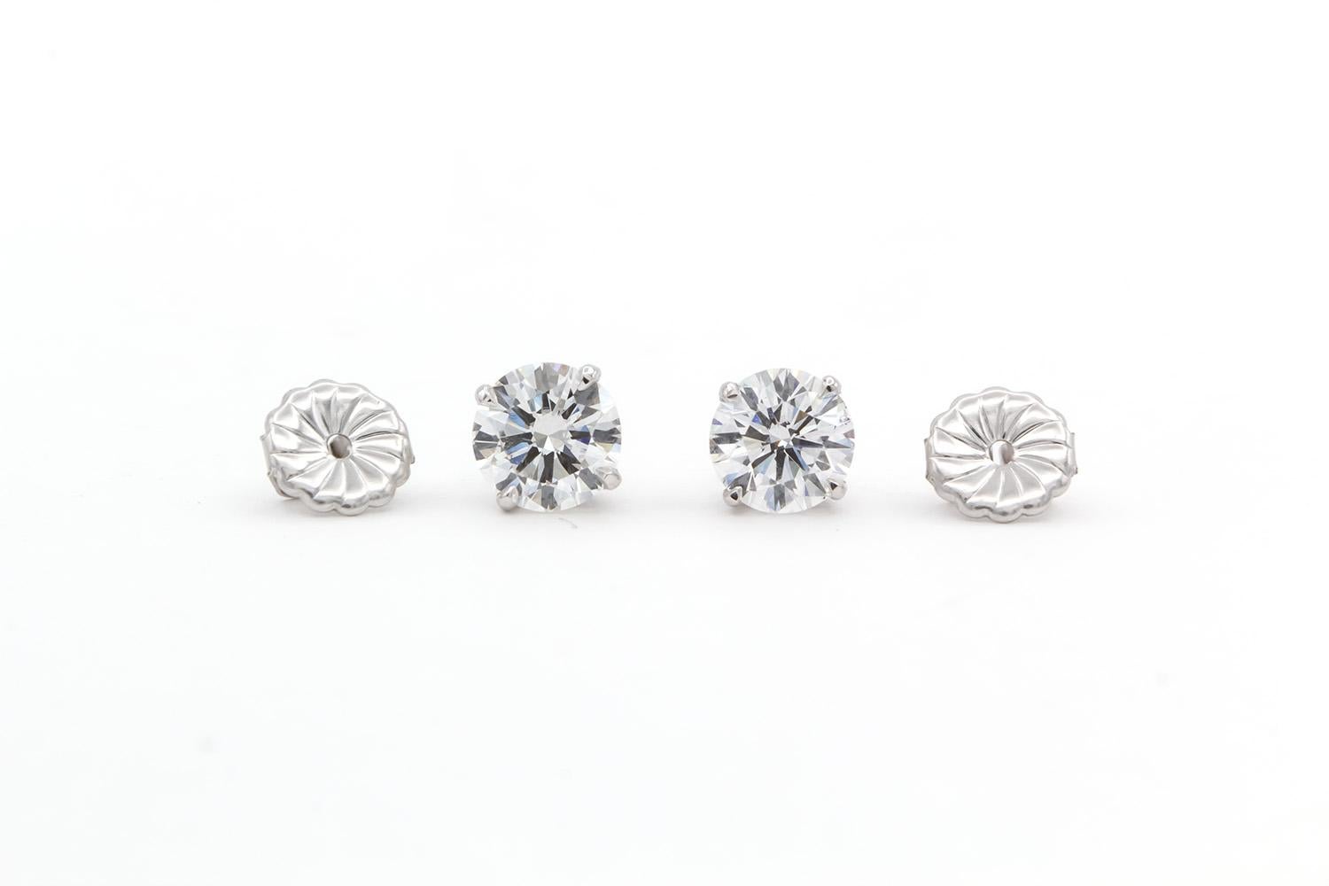 We are pleased to present these GIA Certified 14k White Gold & Round Brilliant Cut Diamond Stud Earrings. These beautiful earrings feature two GIA certified and crown inscribed Diamonds. One 1.16ct F/VS1 Round Brilliant Cut Diamond and one 1.13ct