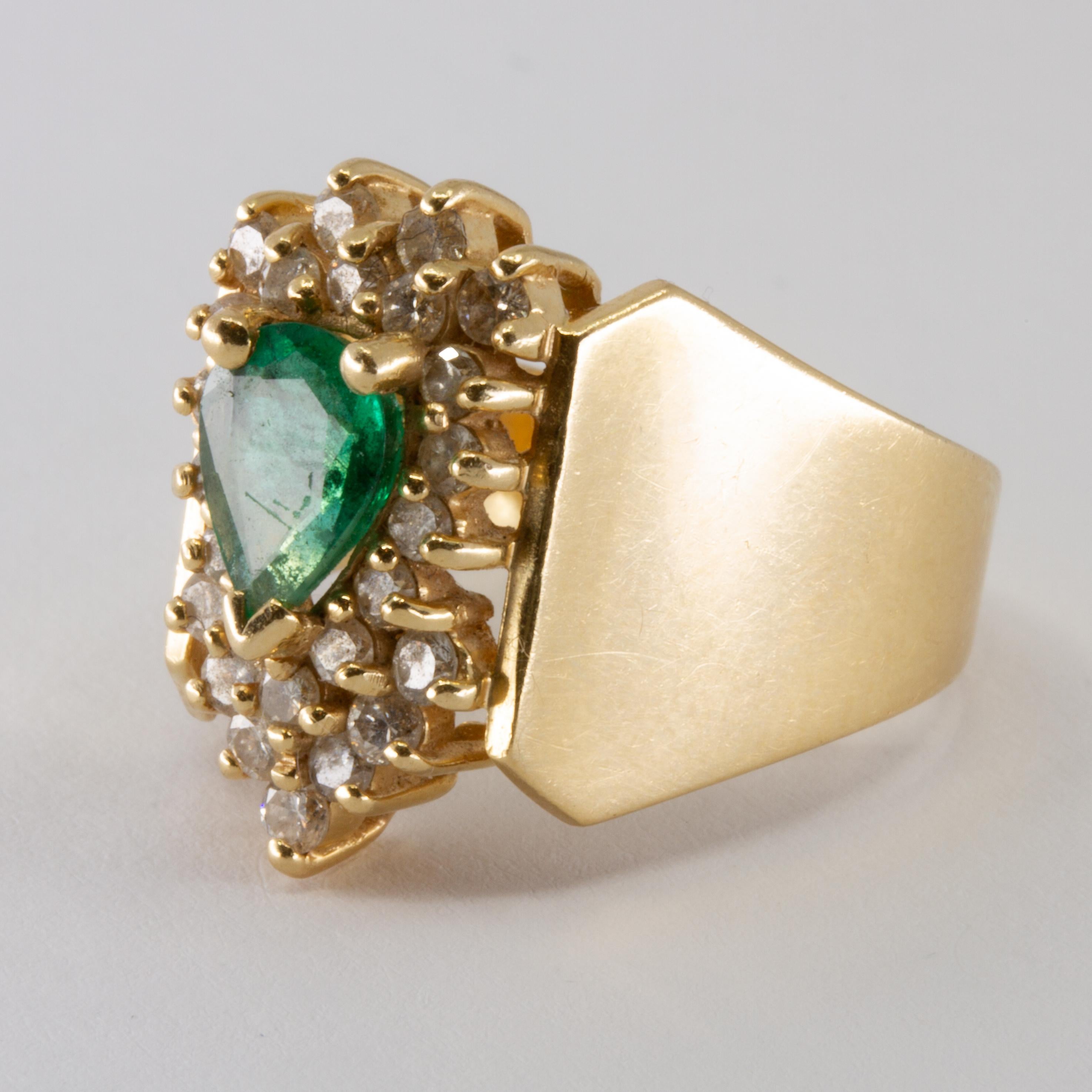 Offered is a 14 yellow gold lady's ring with a pear shaped emerald, dias .50ct Circa 1980. Size 6.5 Accompanied with a GIA appraiser letter. 