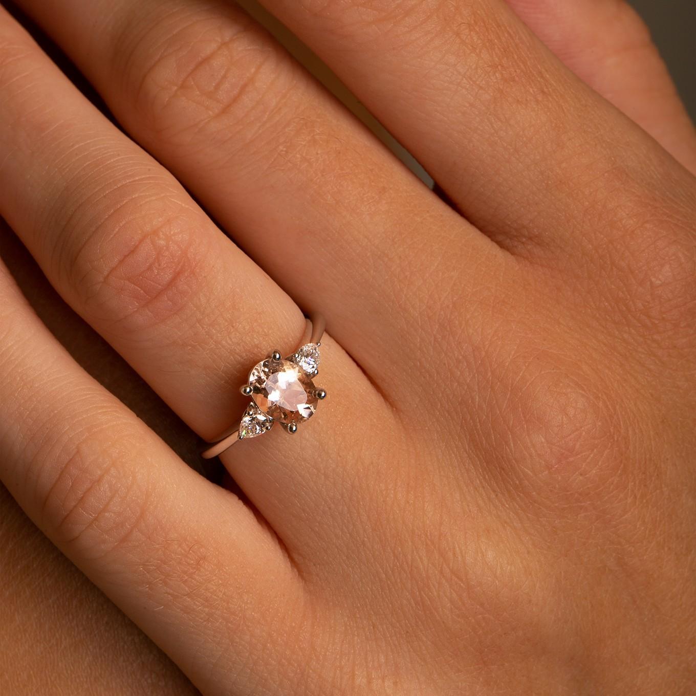 Stunning Eye Catching Peachy Hued Oval Morganite, flanked by scintillating pear-shaped diamonds on each side.
Elegantly set in a polished 14k White gold to complement and contrast the beautiful 1.20 ct Oval Peachy Hued Morganite.
Hand Selected VS