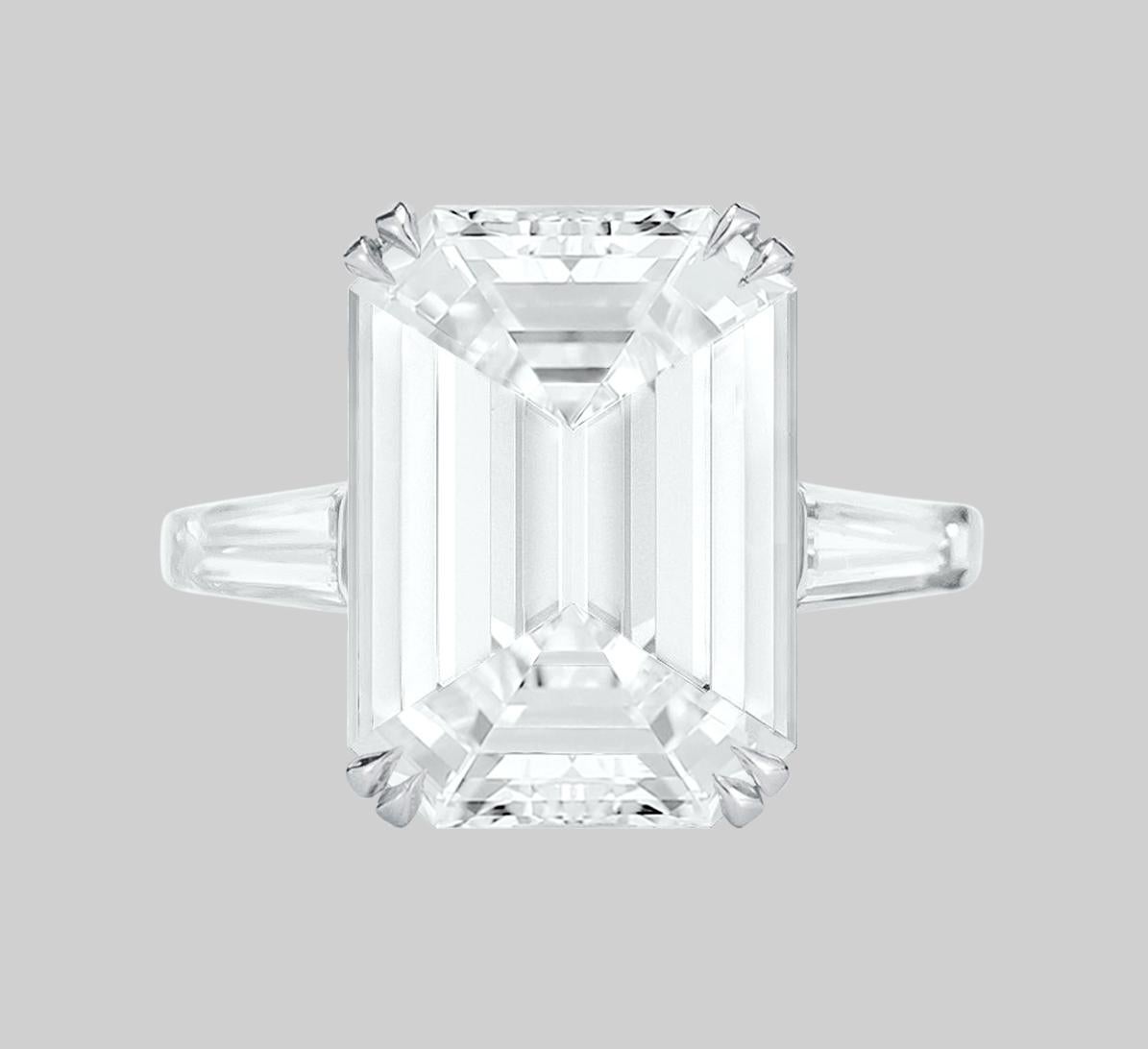 An exquisite 15 carat flawless emerald cut diamond with two tapered baguette diamonds
color is D
clarity is Internally Flawless
Excellent polish
Excelelnt symmetry
None Fluorescence 
18.07 mm!