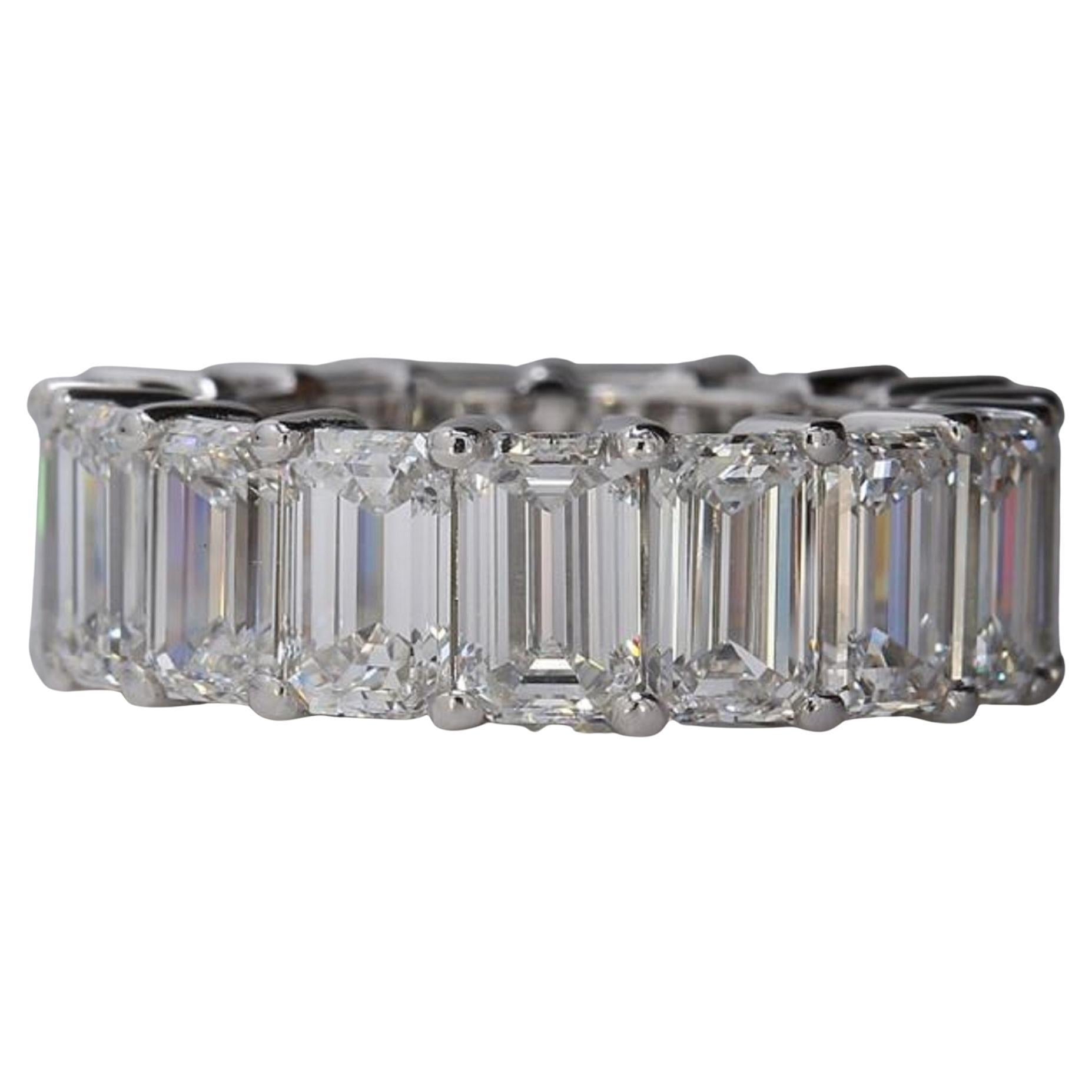 Eternity band in platinum with eagle claw basket set GIA certified F-G/VVS1-VS2 (15) emerald cut diamonds. D15.38ct.t.w. Size 6.5
