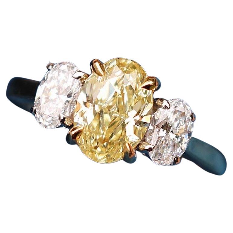 GIA Certified 1.5 carat Fancy Yellow Oval Diamond Ring For Sale