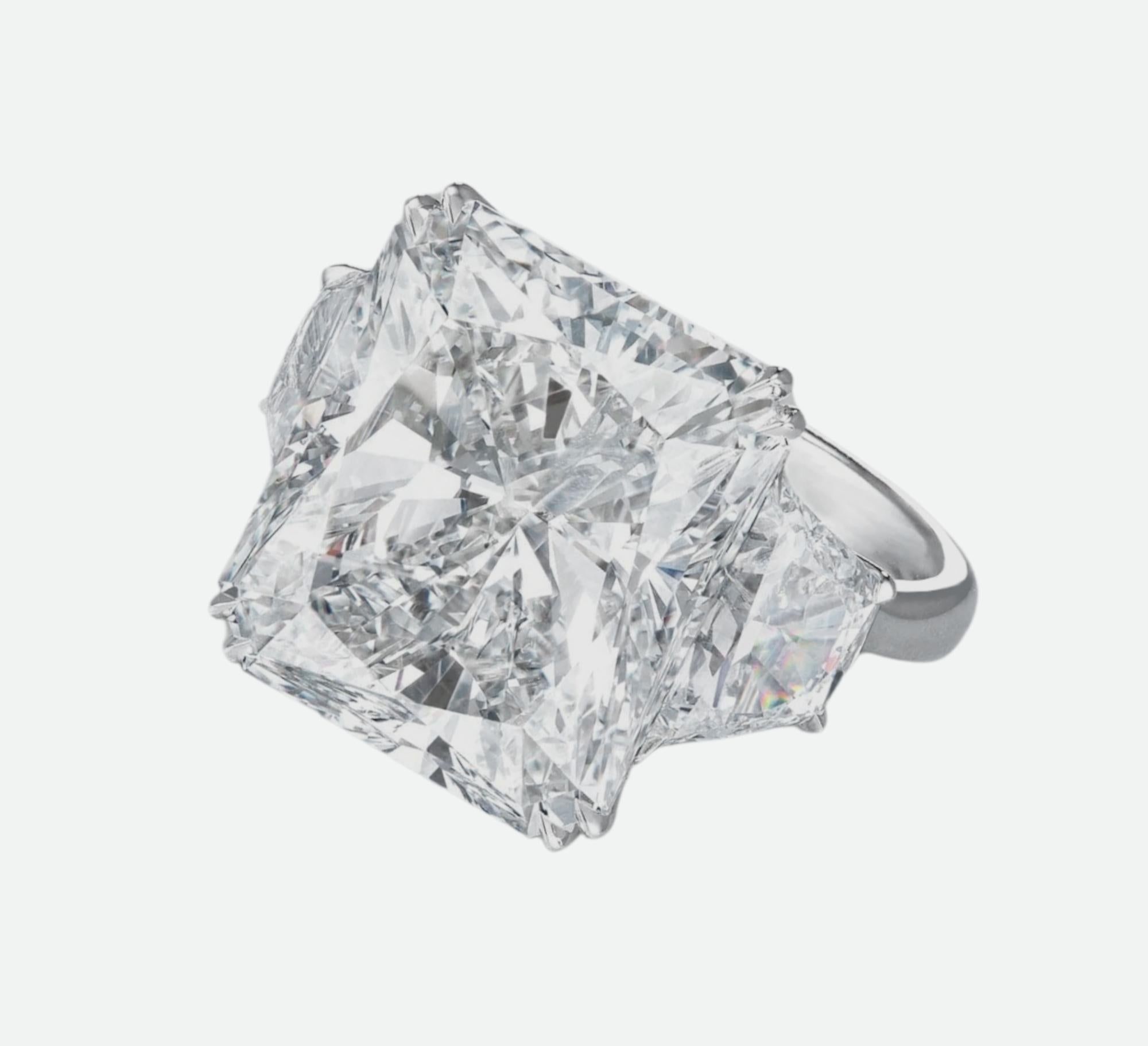 An exquisite GIA certified 15 Carat Radiant Cut diamond ring.

The ring has two side Trapezoids that sum 

F color
vvs2 clarity 

