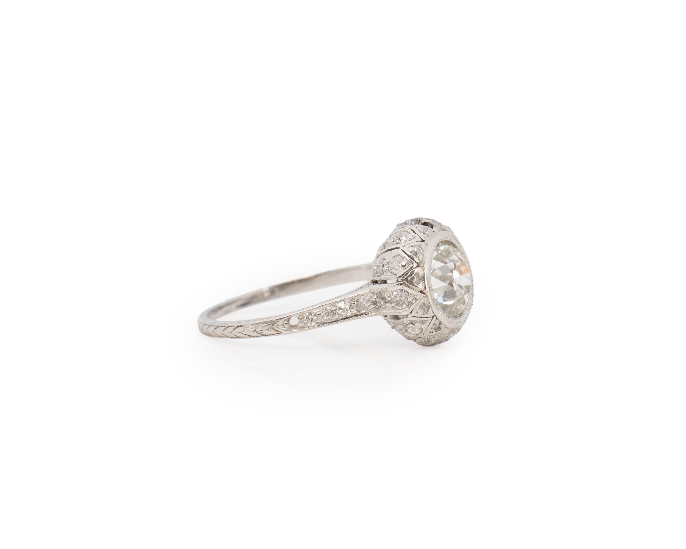 Ring Size: 7
Metal Type: Platinum [Hallmarked, and Tested]
Weight: 3.8 grams

Center Diamond Details:
GIA LAB REPORT #: 2221848985
Weight: 1.50ct
Cut: Old European brilliant
Color: K
Clarity: VS1
Measurements: 7.13mm x 7.28mm x 4.73mm

Side Diamond