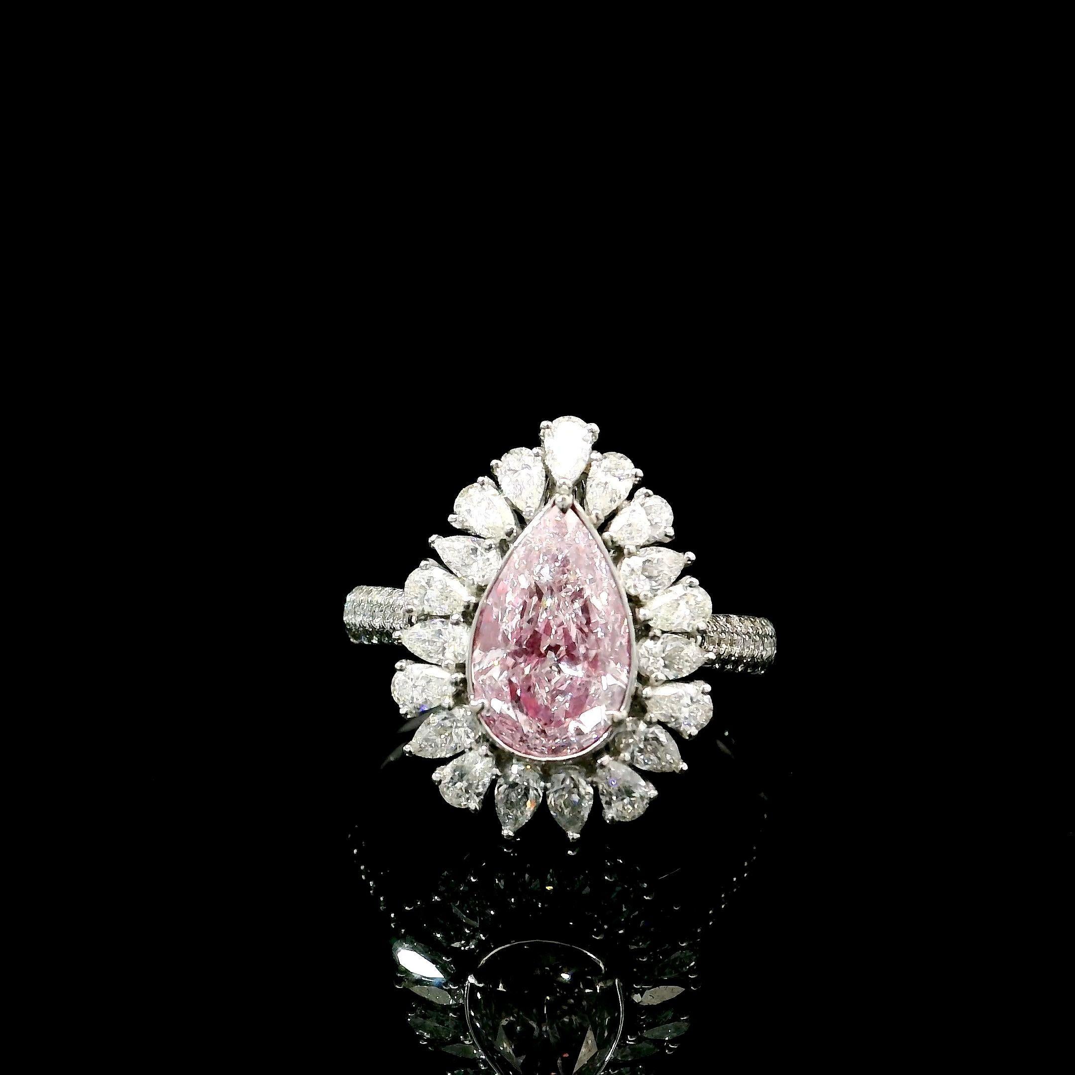 18kt white gold ring with diamonds
  
  Gold colour & karat: White gold 18kt
  Weight: 5.75 grams
  
  Set with-
  Stone type: Diamonds
  Shape: Pear
  Carat: 1.50 ct
  Colour: Light Pink 
  Clarity: SI2
  
  Surrounding Stones: Diamonds
 1) White