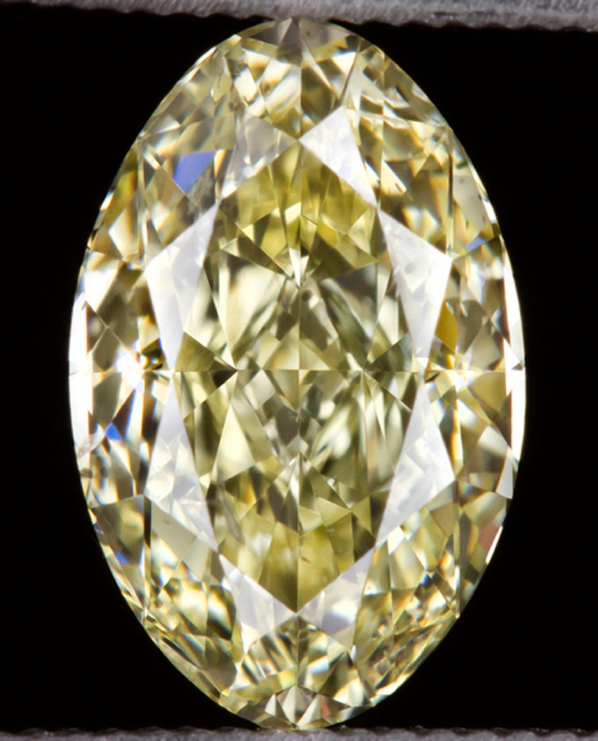  GIA certified diamond is 100% eye clean and has a beautiful light yellow hue! The cut combines aspects of the marquise cut and the oval cut, therefore it can be referred to as a “moval.” This is a very rare shape! Movals were only cut with some