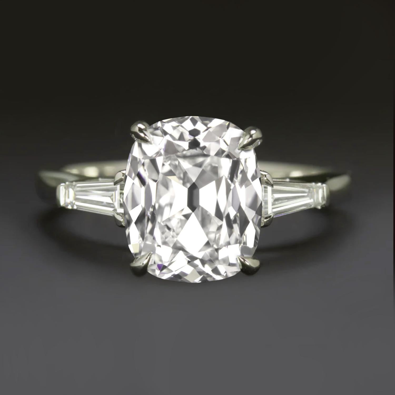✨ A timeless treasure with vintage soul and modern sophistication.
This exquisite platinum ring showcases a 1.71 carat Old Mine Brilliant Cut diamond, GIA certified I color / SI1 clarity, full of antique charm and fire.
Flanked by two tapered