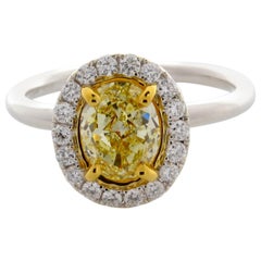 GIA Certified 1.50 Carat Oval Cut Natural Fancy Light Yellow SI1 Diamond Ring
