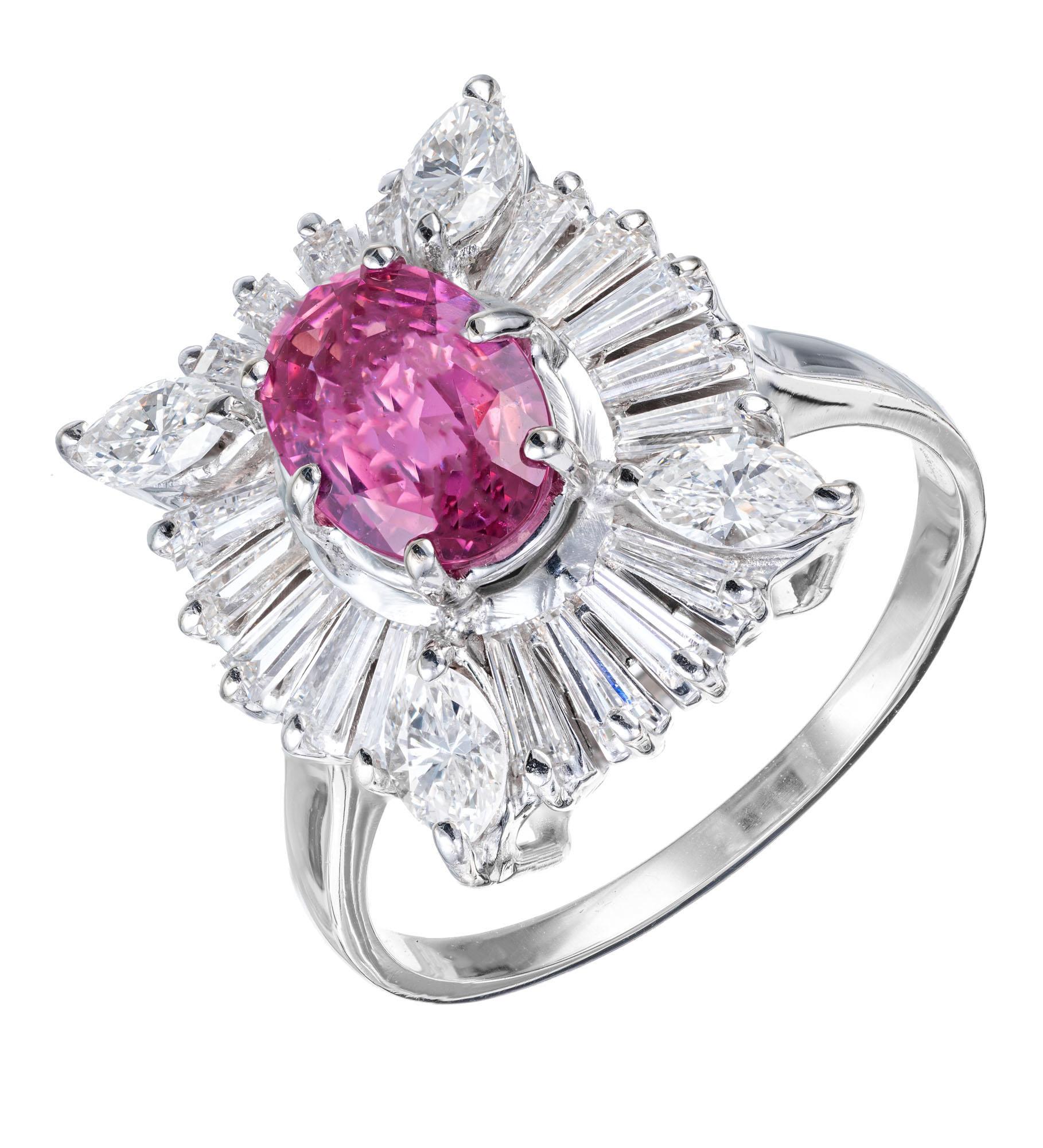 1950's pink sapphire and diamond engagement ring. GIA certified 1.50ct oval pink sapphire center stone set in 14k white gold with a halo of tapered baguette and marquise diamonds. GIA certified natural corundum, simple heat only, no other