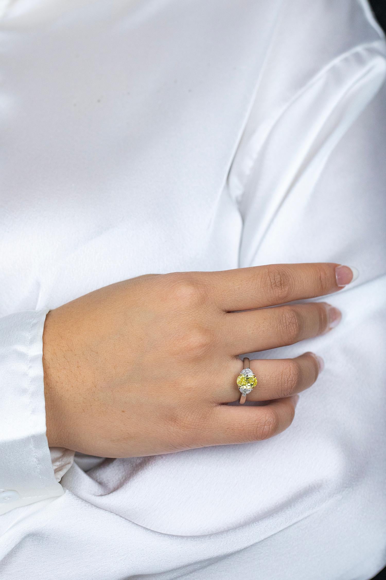 Women's GIA Certified 1.50 Carats Oval Cut Yellow Diamond Three-Stone Engagement Ring For Sale