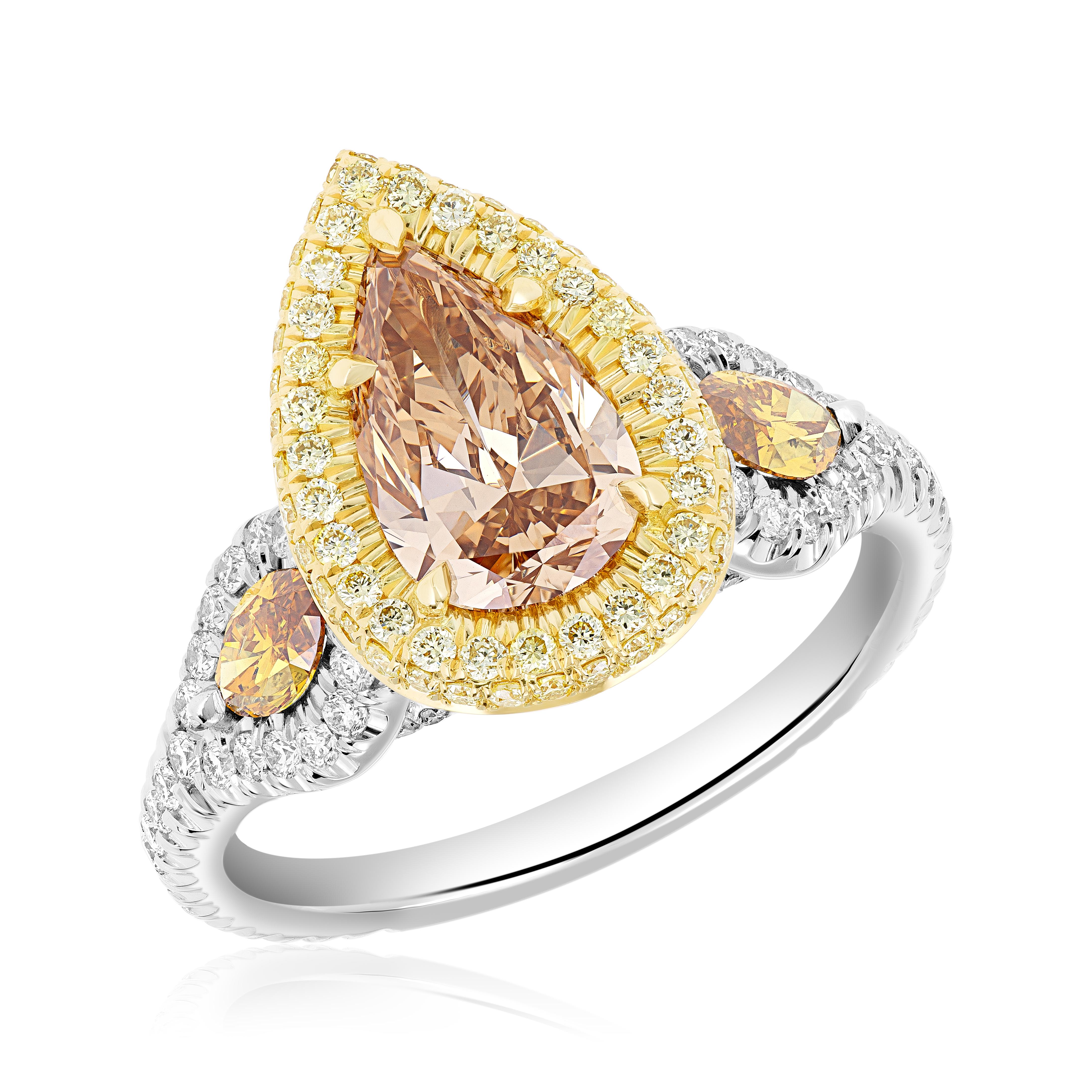 Make a striking statement with our exquisite handmade pear-shaped fancy deep brown-yellow ring! This extraordinary one-of-a-kind piece showcases a stunning 1.50-carat pear-shaped diamond with a VS2 clarity, certified by the prestigious GIA, bearing