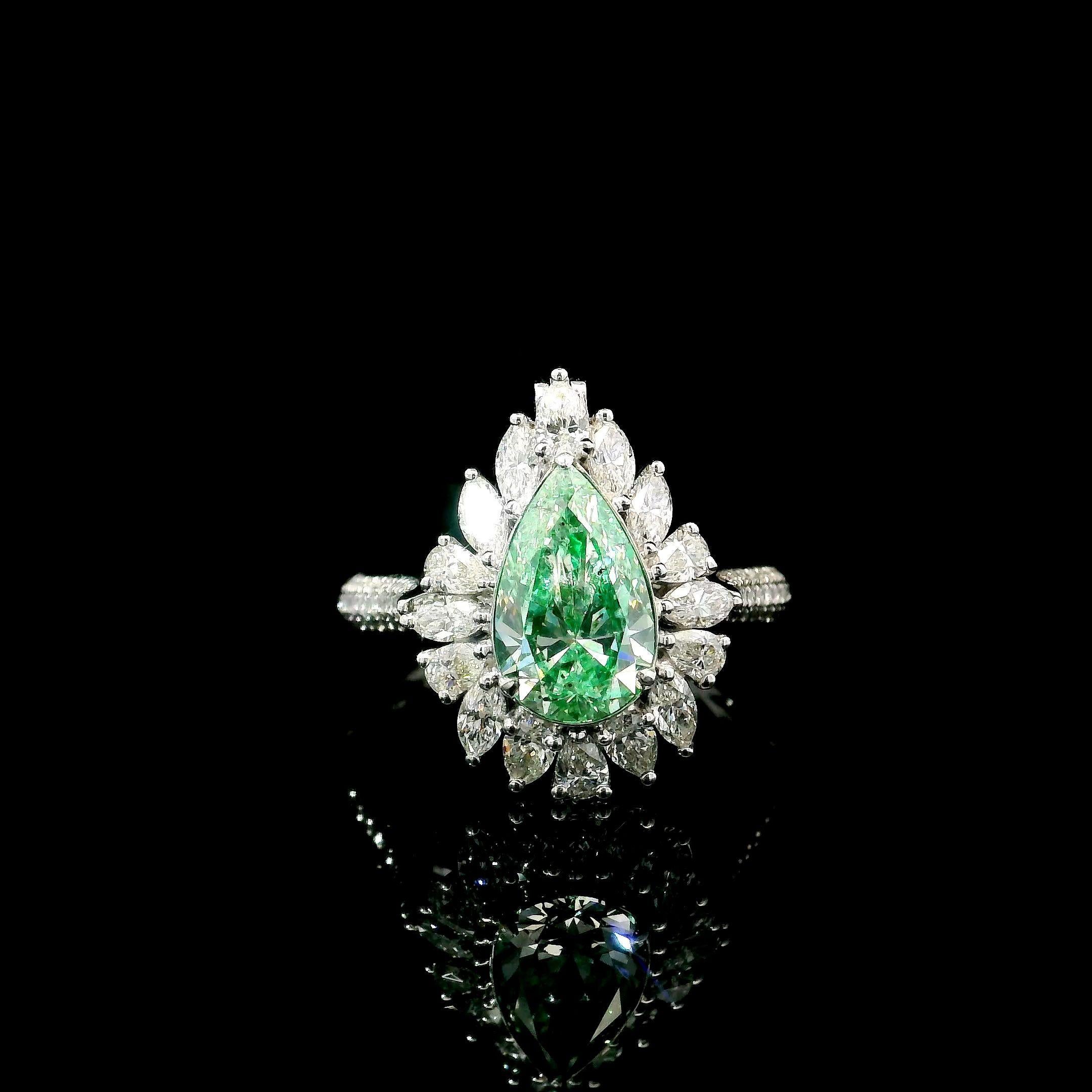 18kt white gold ring with diamonds
  
  Gold colour & karat: White gold 18kt
  Weight: 4.94 grams
  
  Set with-
  Stone type: Diamonds
  Shape: Pear
  Carat: 1.51
  Colour: Faint Yellow Green
  Clarity: SI2
  
  Surrounding Stones: Diamonds
 1)