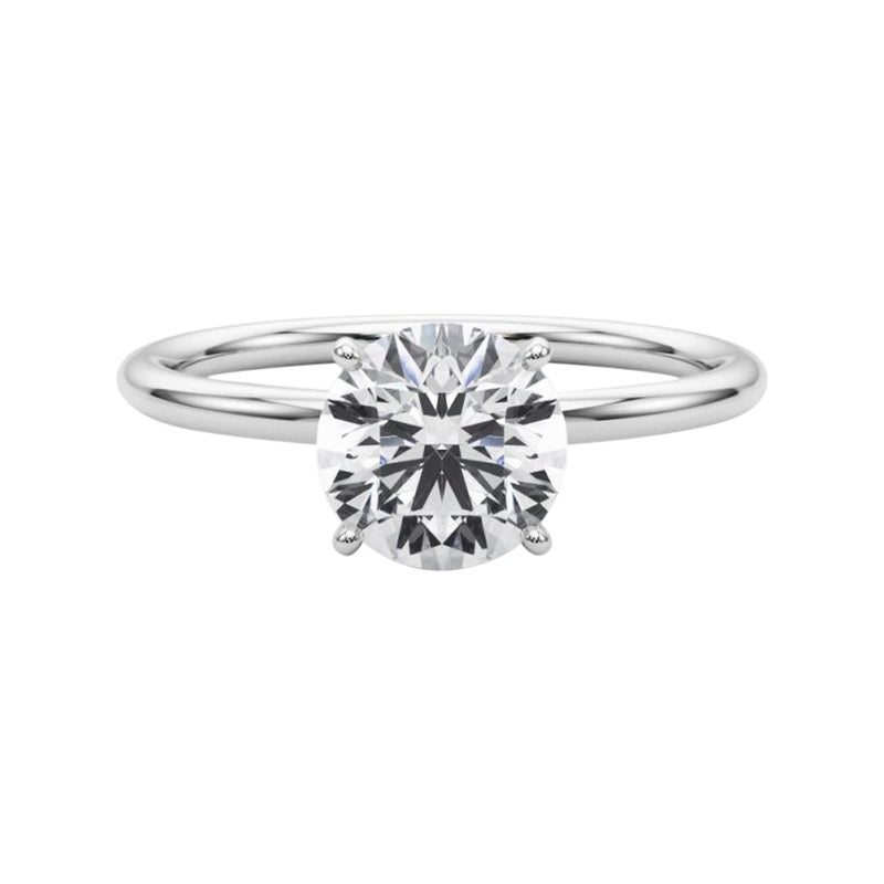 Bague à diamant en platine certifiée GIA de 1.51 carat avec halo caché et solitaire rond