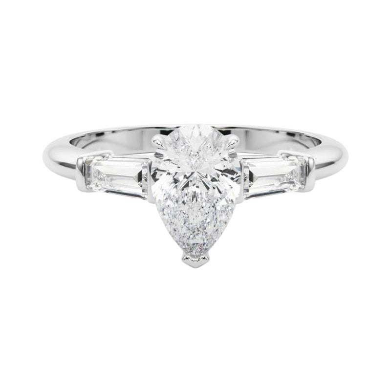Bague à trois pierres en platine avec diamant poire et baguette de 1.51 carat certifié par le GIA