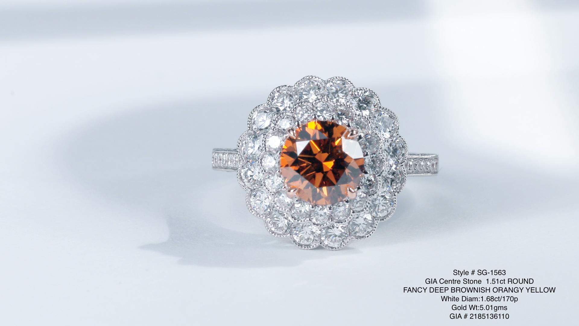 Introducing a mesmerizing jewel that radiates with warmth and elegance, behold this stunning ring featuring a brilliant-cut 1.51ct round brilliant natural fancy color diamond. This remarkable gem boasts a captivating Fancy Deep Brownish Orangy