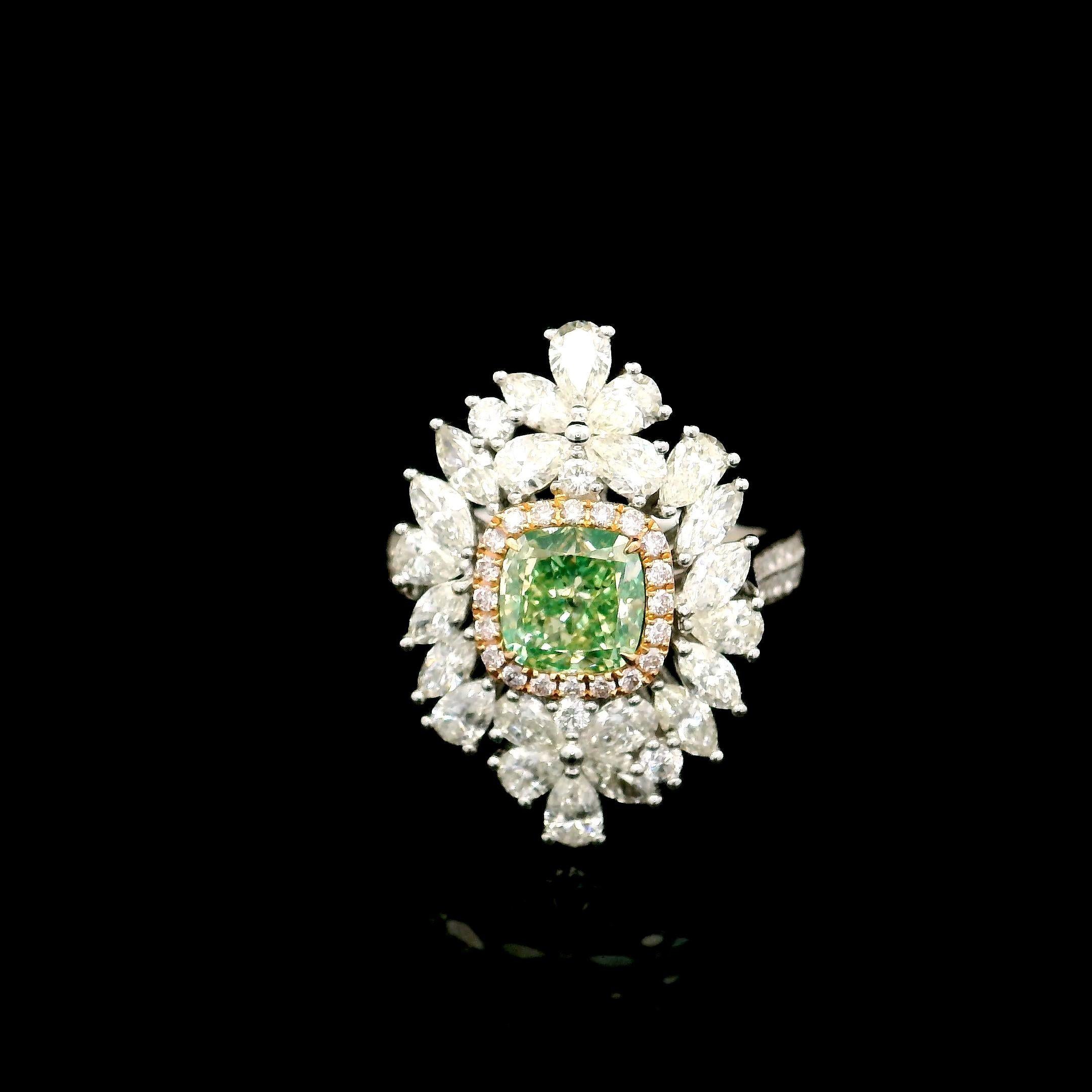 18kt white gold ring with diamonds
  
  Gold colour & karat: White gold 18kt
  Weight: 7.57 grams
  
  Set with-
  Stone type: Diamonds
  Shape: Cushion
  Carat: 7.57 ct
  Colour: Fancy Greenish Yellow
  Clarity: SI2
  
  Surrounding Stones: