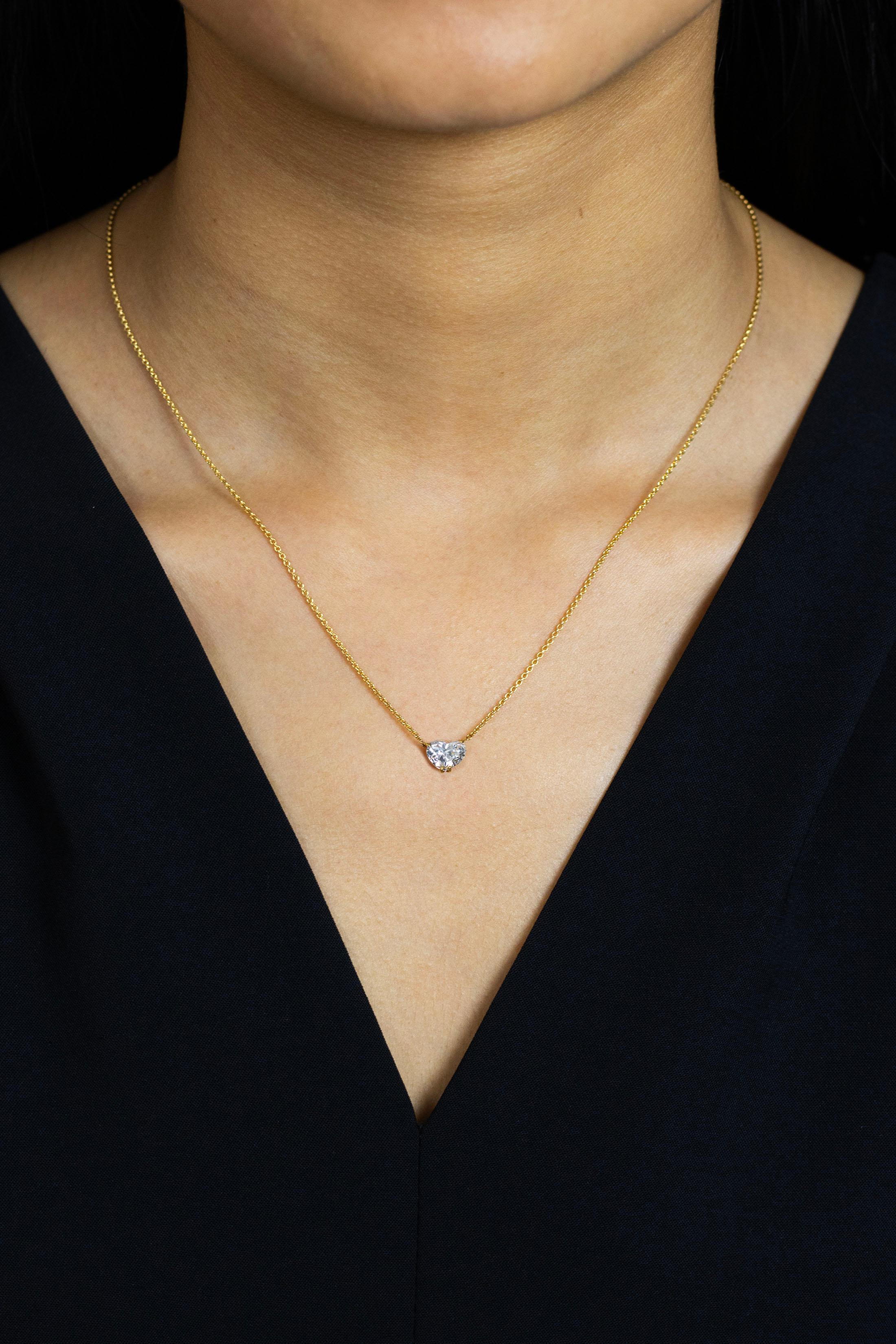 A classic heart shape pendant necklace showcasing a 1.52 carats brilliant heart shape diamond certified by GIA as F color, SI1 clarity. The pendant is set on a 14k yellow gold basket and suspended on an adjustable 16 inch yellow gold chain.

Style