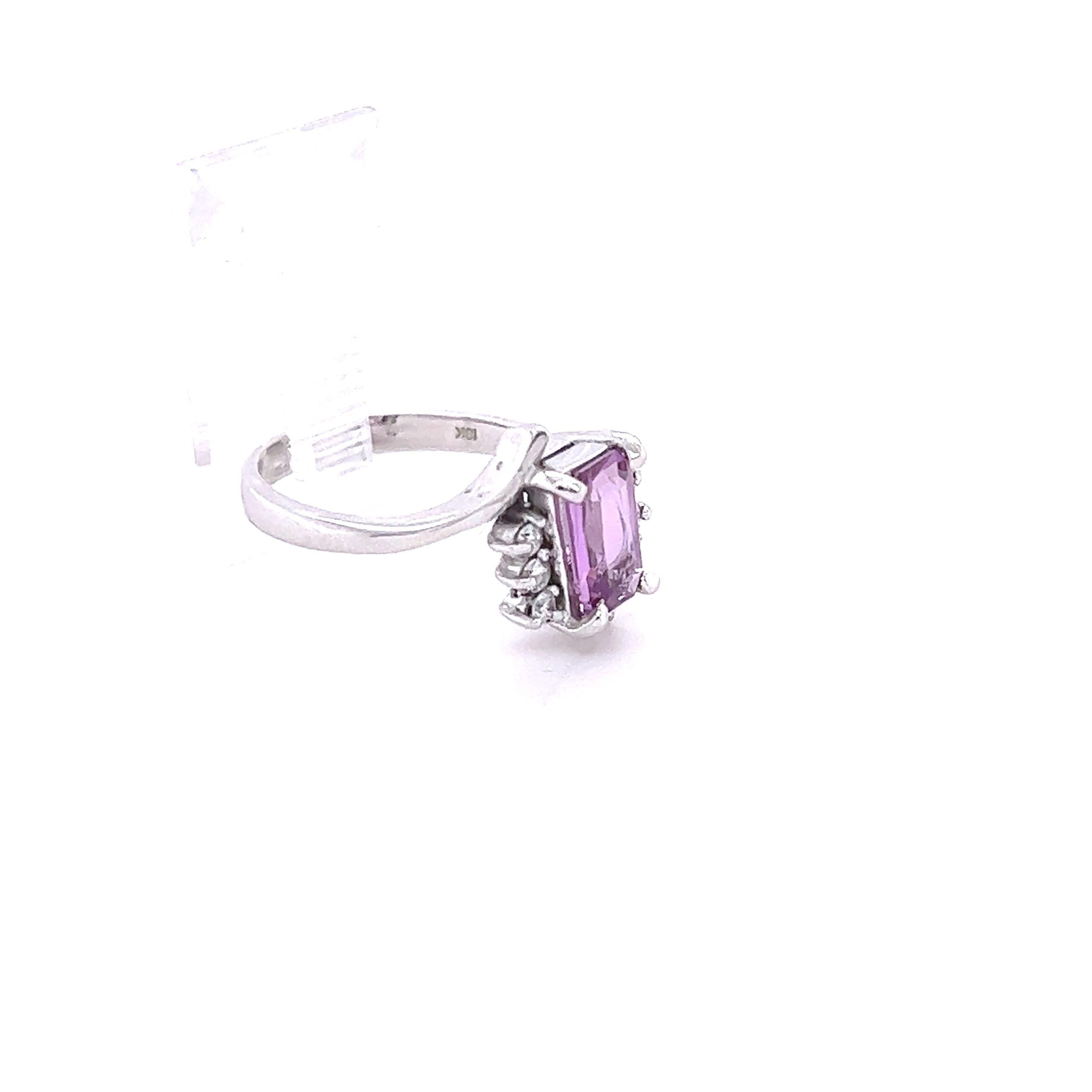 This beautiful ring has a Natural Emerald Cut Pink Sapphire that weighs 1.37 Carats and measures at approximately 9 mm x 5 mm. The Pink Sapphire is GIA Certified and does NOT show indications of heating. The GIA Certificate Number is: