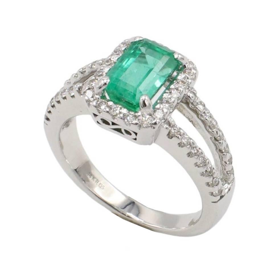 GIA Certified 1.53 Carat Emerald & Natural Diamond Halo Engagement Ring 
Metal: 14k white gold
Weight: 4.88 grams
GIA report number: 2231413818
Emerald: 1.53 carat emerald cut natural green emerald
Diamonds: Approx. 0.50 CTW round natural G-H VS