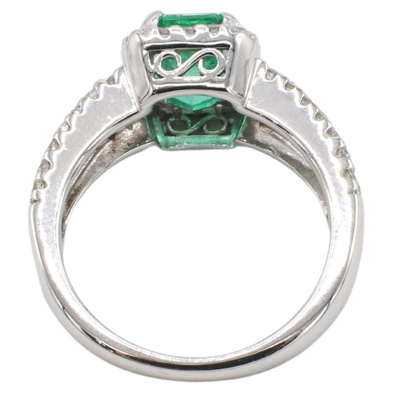 Modern GIA Certified 1.53 Carat Emerald & Natural Diamond Halo Engagement Ring For Sale