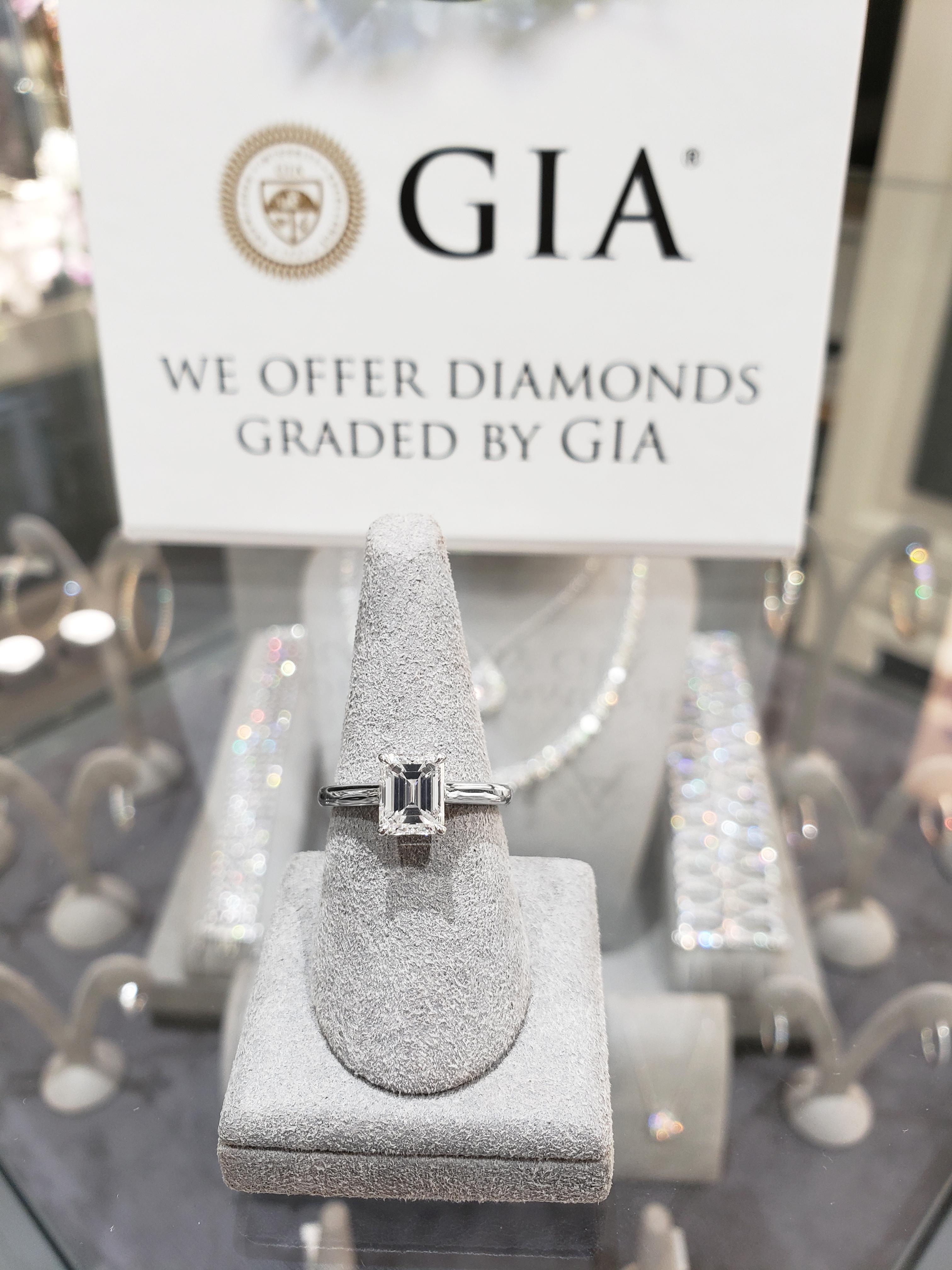 A classic engagement ring style showcasing a single emerald cut diamond center stone set in a rounded platinum composition. GIA certified the diamond as H color, VVS2 clarity, and weighs 1.54 carats. A timeless piece that accentuates the beauty of