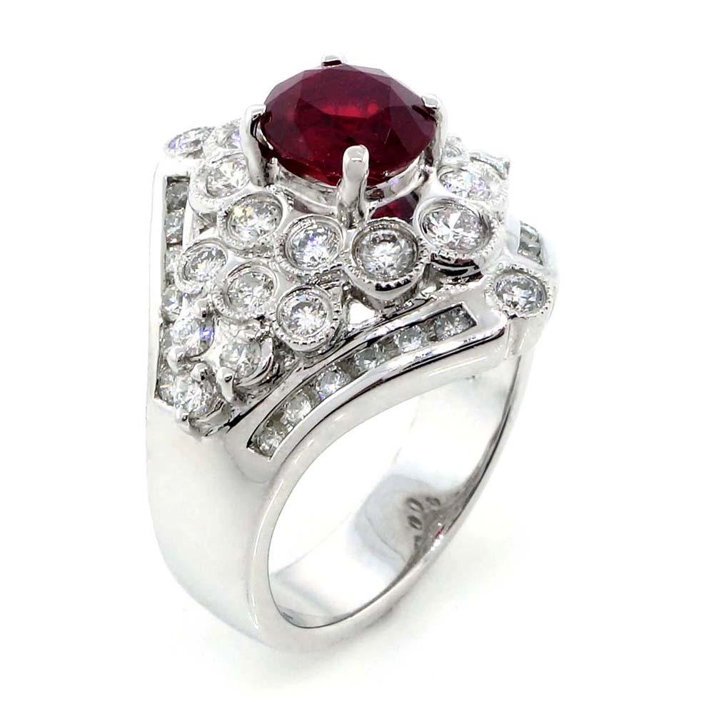GIA certified ruby of about 1.54 carats measuring 7.01×5.89×4.30 mm surrounded by 48 round brilliant cut diamonds of about 1.26 carats with a clarity of VS and color G. All stones are set in 18k white gold. Total weight of the ring is approximately