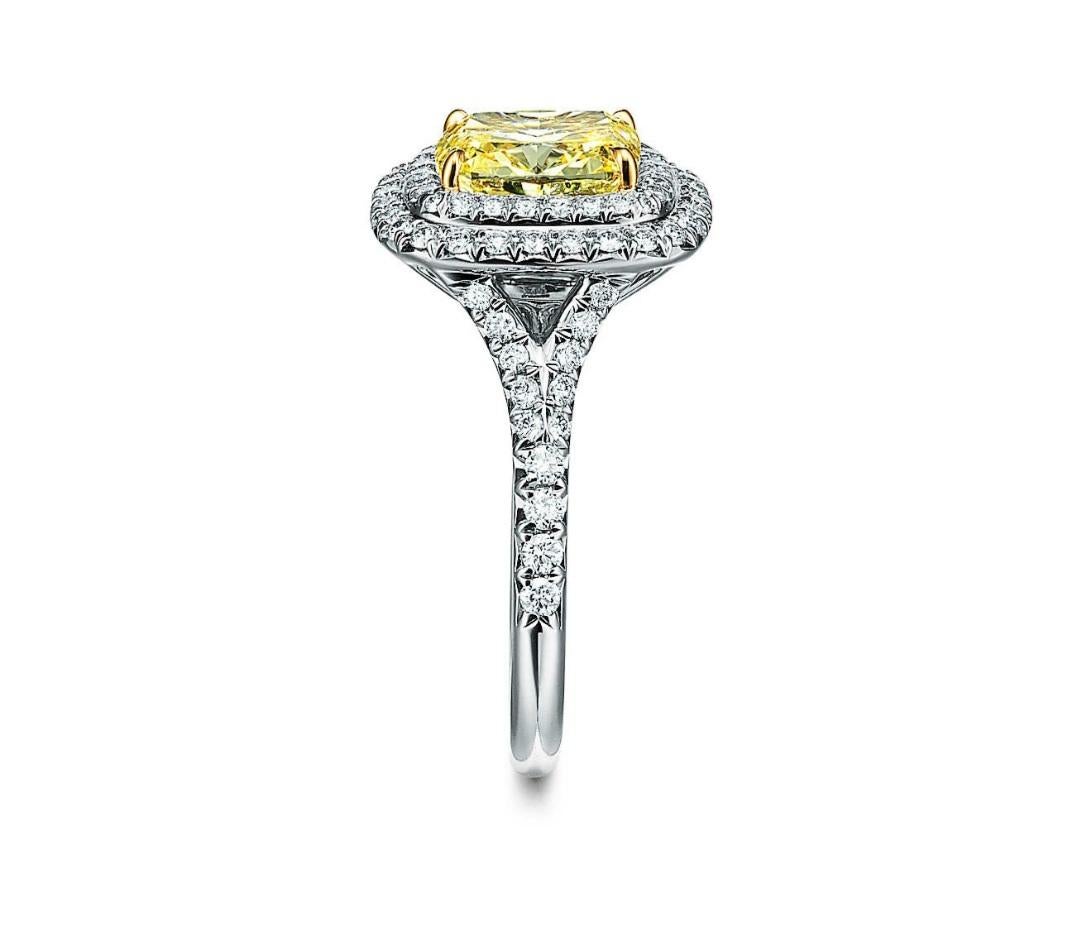 This top hue Fancy Yellow Si2+ Cushion Cut Diamond is certified by the GIA Laboratory. The 1.54 carats of natural perfection represents Japanese divinity, or 'Kami'. We created a ring with 18K White Gold to bring out the best in the Jewels. 

The