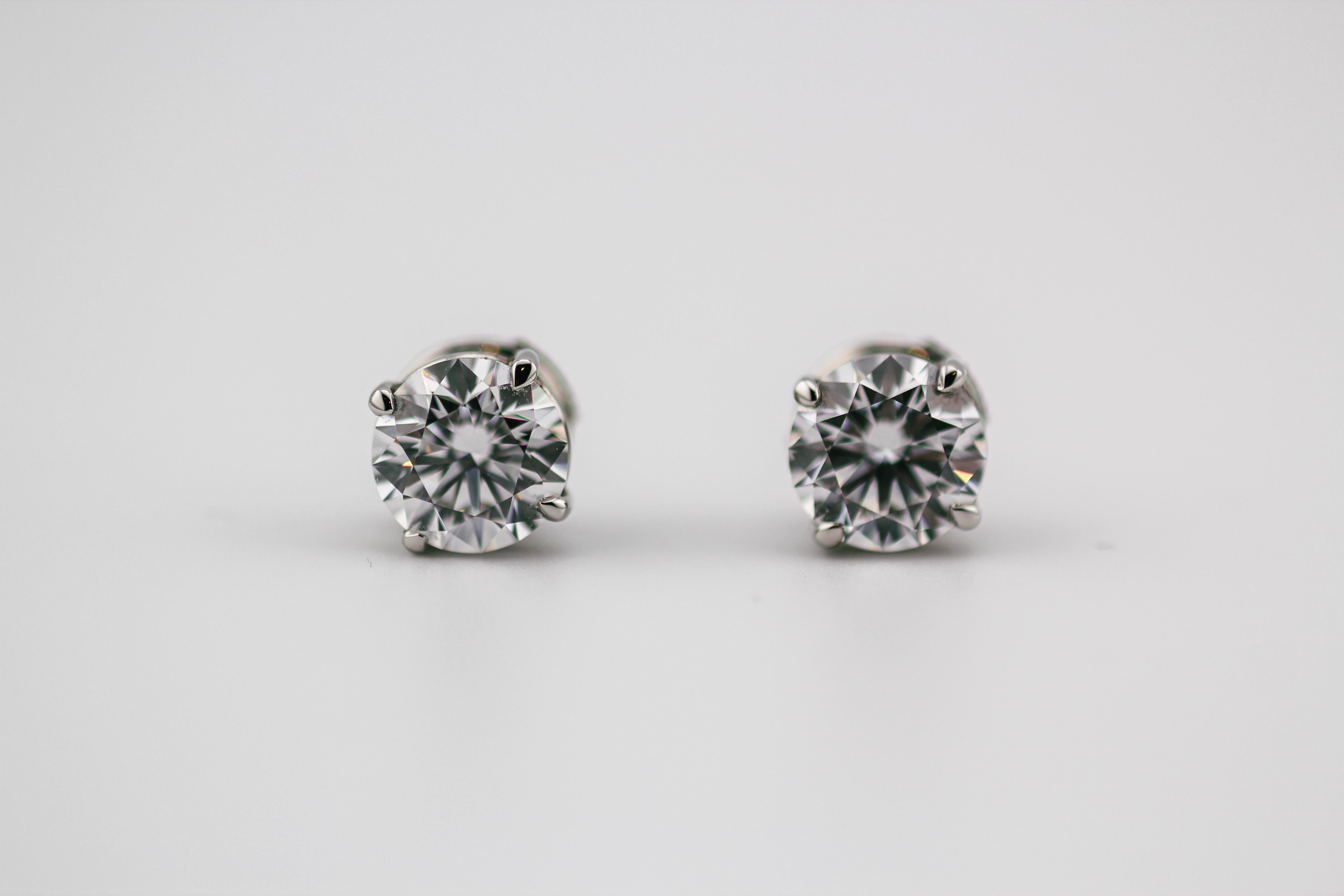 Behold the epitome of sophistication and purity in the form of this exquisite pair of GIA Certified 1.55 + 1.51 carat D Color IF Clarity Diamond Platinum Studs Earrings. Crafted with precision and elegance, these earrings are a celebration of