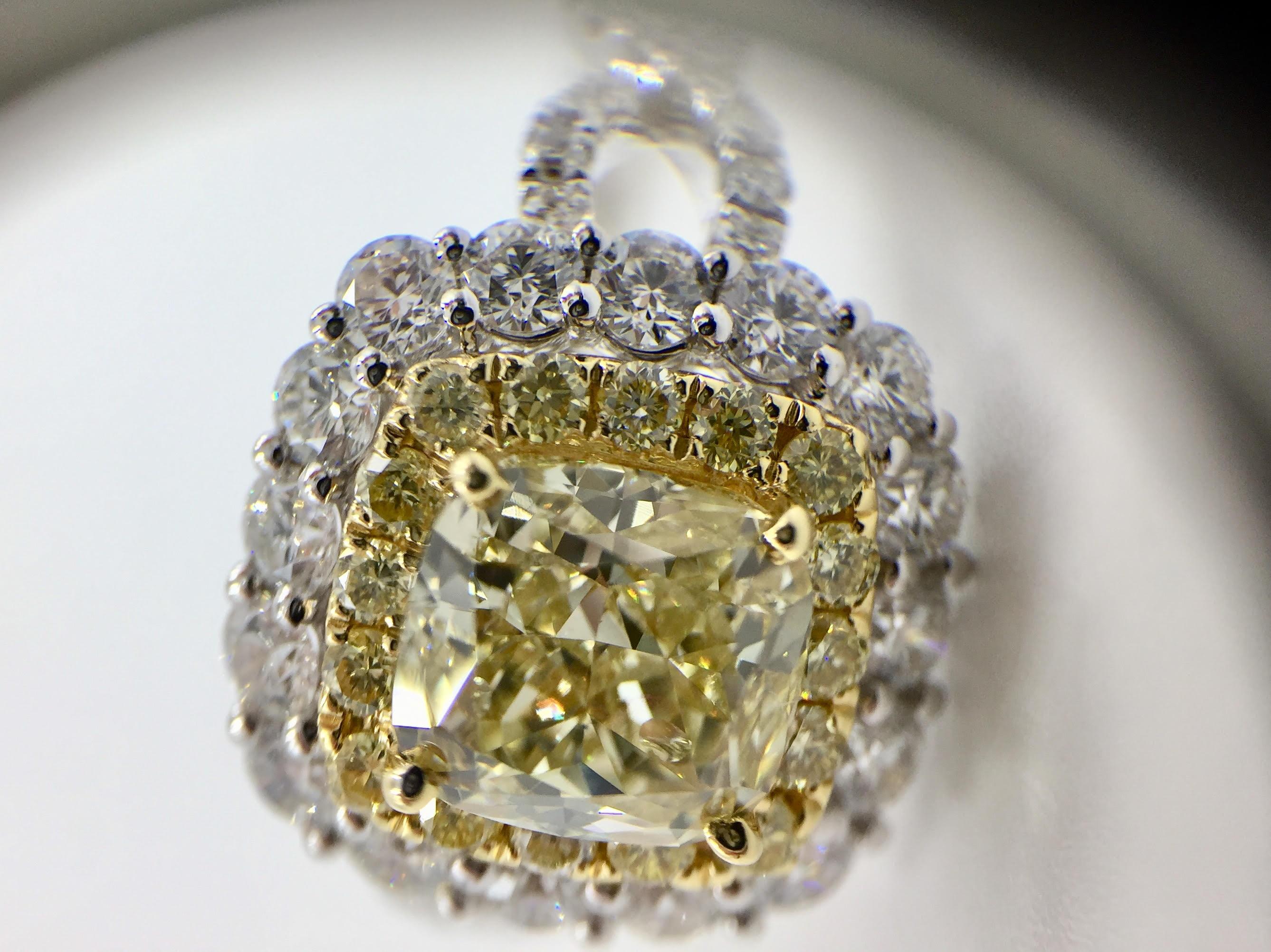 GIA Certified 1.55 Carat Natural Fancy Yellow Diamond Halo Ring In New Condition In Pikesville, MD