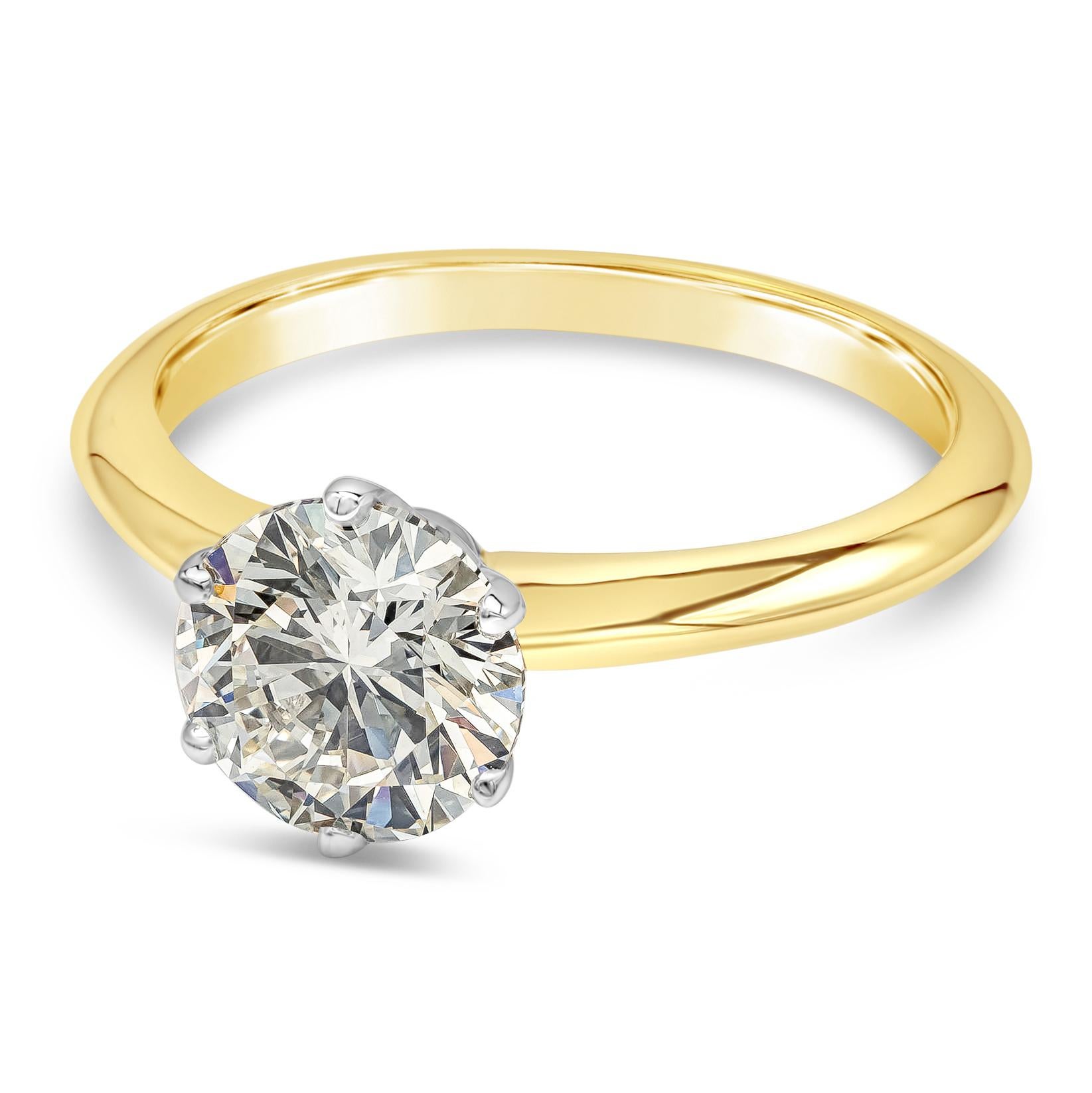 A timeless engagement ring style showcasing a 1.55 carat round brilliant diamond, set in a six-prong, knife edge setting made in Platinum & 18k gold. GIA certified the diamond as L color, VS2 clarity. Size 6.5 US (Sizable upon request).

Style