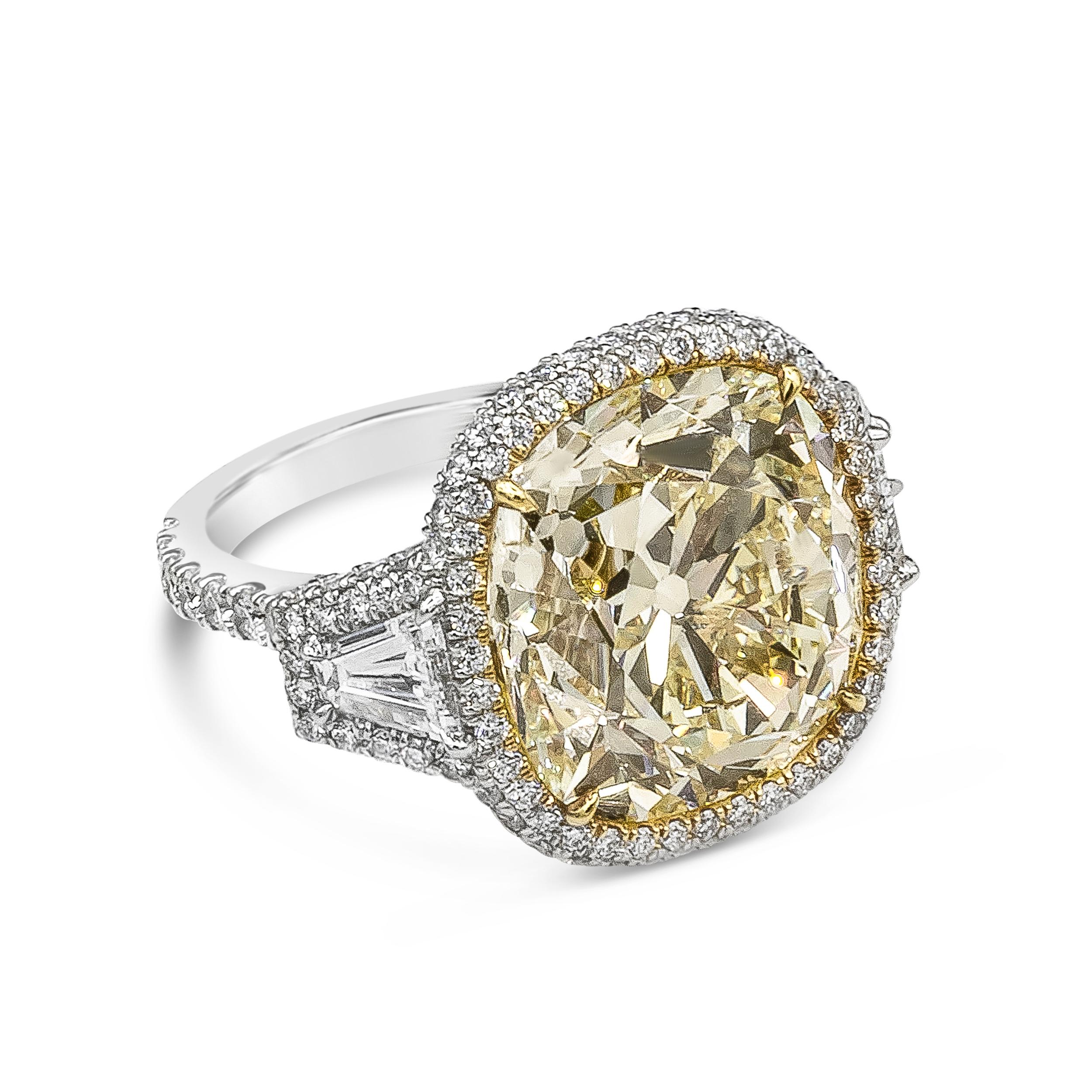 An important piece of jewelry showcasing a 15.52 carat cushion cut yellow diamond, certified by GIA as Fancy Yellow color, VS1 clarity. The center diamond is flanked by tapered baguette diamonds and is surrounded by round brilliant diamonds. Accent