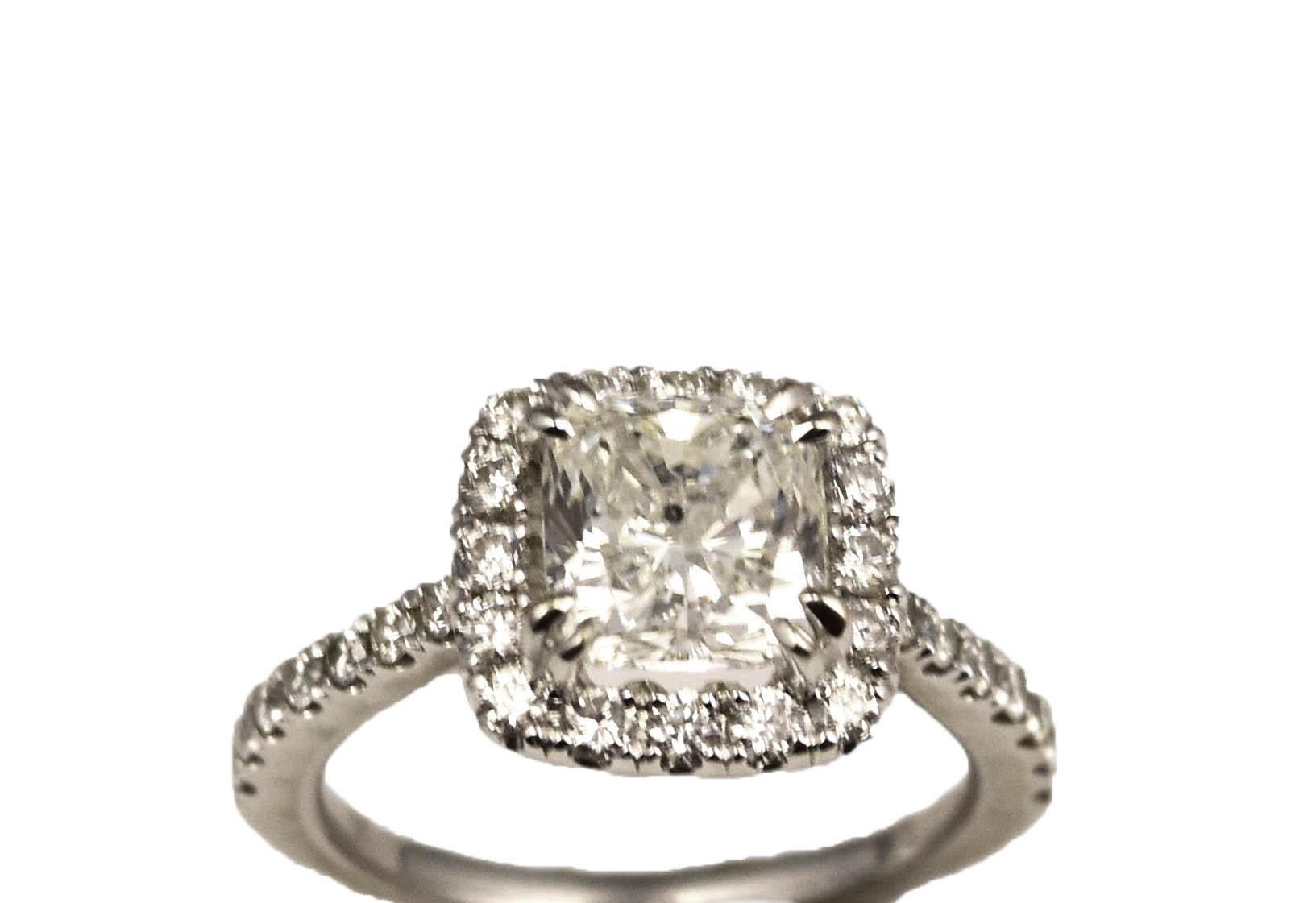 Carat Weight: Approx. 1.58 carat

Color Grade: H

Clarity Grade: I1

Shape and Cutting Style: Cushion Modified Brilliant

Metal: White Gold 

Metal Purity : 18 k

Polish: Very Good

Symmetry: Very Good

Fluorescence: None

Ring Size: 4.25