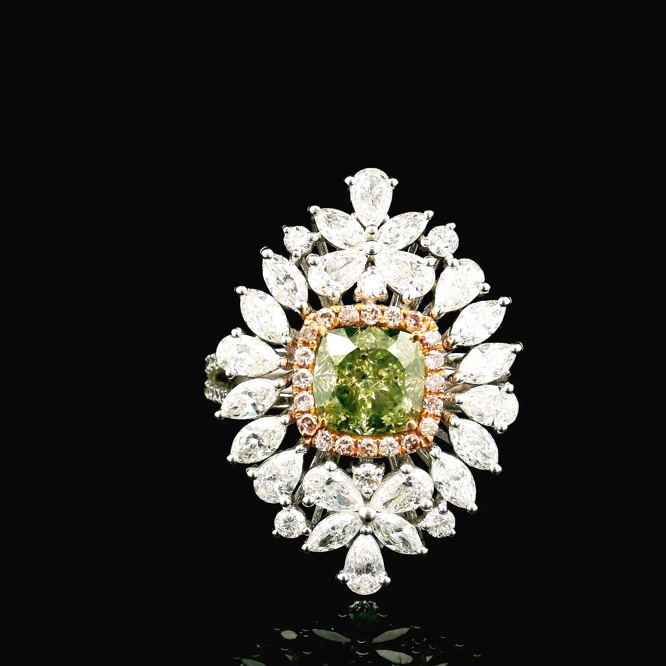 18kt white gold ring with diamonds
  
  Gold colour & karat: White gold 18kt
  Weight: 7.230 grams
  
  Set with-
  Stone type: Diamonds
  Shape: Cushion
  Carat: 1.59 ct
  Colour: Fancy Brownish Greenish Yellow
  Clarity: SI1
  
  Surrounding