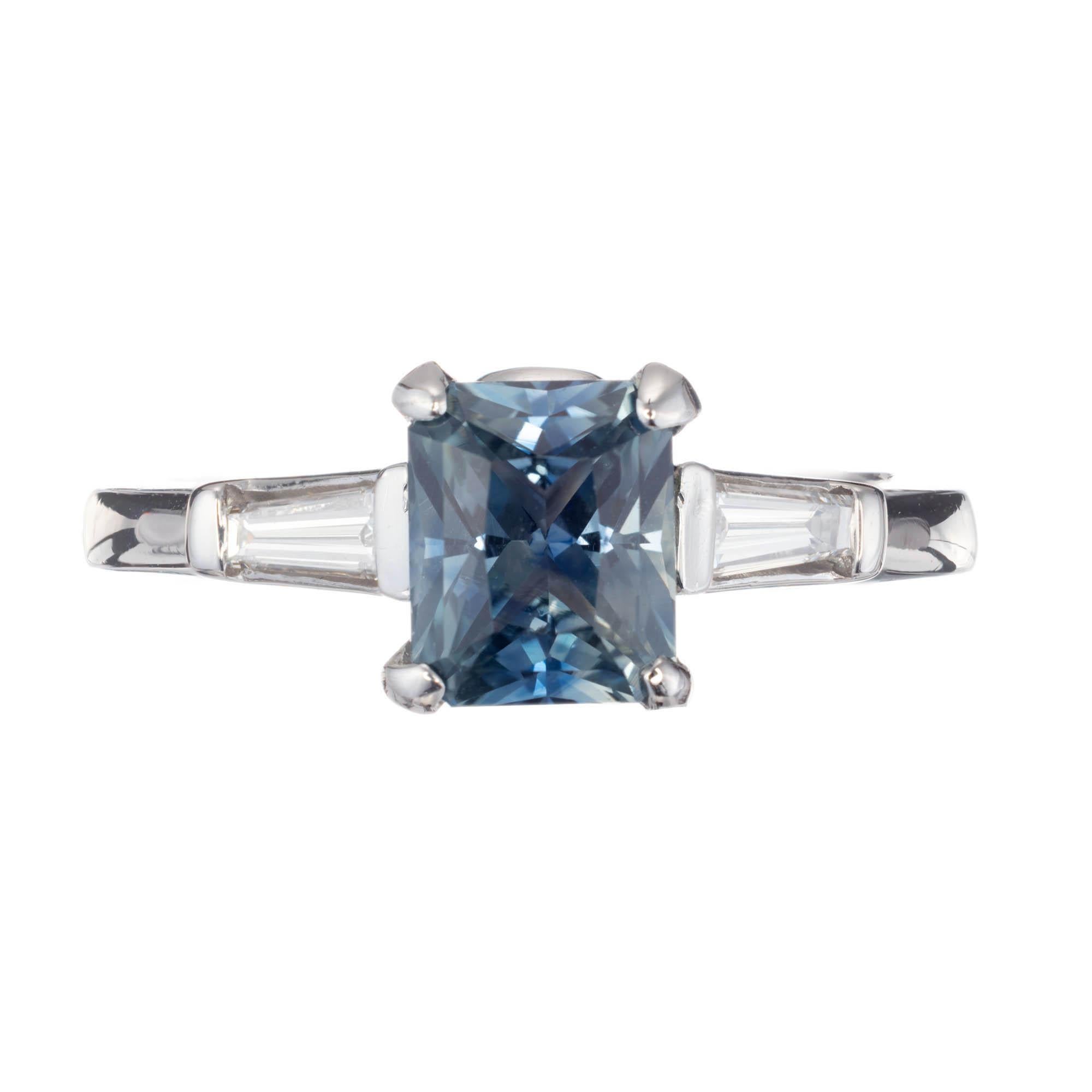 Vintage 1950s green blue Sapphire and Diamond Engagement Ring. Certified GIA sapphire center stone, accented with 2 tapered baguette diamonds on each site of the platinum setting. 

1 octagonal greenish blue sapphire, Approximate 1.59 carats GIA