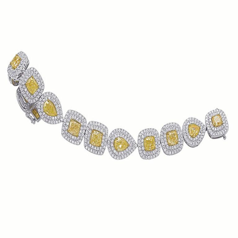 Elegant GIA Certified 15.94 Natural Fancy Yellow Diamond Bracelet made by Shimon's Creations. This bracelet features 11.87 Carats of Natural Fancy Yellow Diamonds and 4.07 Carats of White Diamonds. The White Diamonds are SI1 Quality and G-H Color.