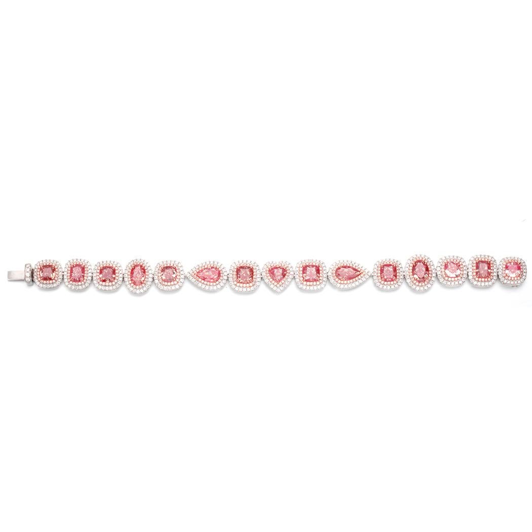 Introducing an exquisite and truly captivating piece of jewelry, the GIA Certified 15Pcs Natural Pink Diamond Mix Shapes Tennis Bracelet in 18KT Gold. This stunning bracelet is a true testament to the beauty of nature's rarest treasures,