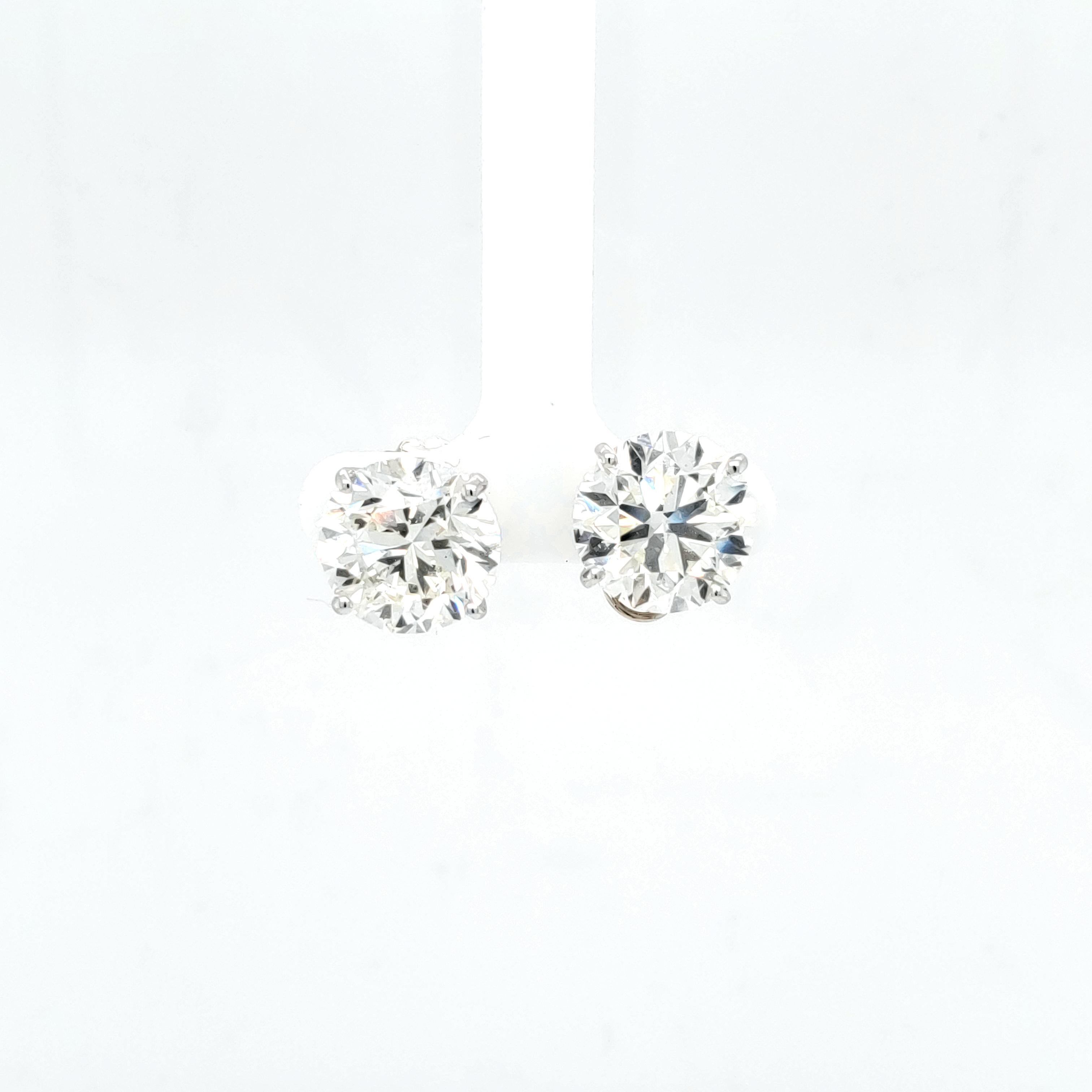 GIA certified 8.06 carat M color Si1 clarity. GIA certified 8.10 carat M SI1 clarity. Set in 14k White gold 4 prong. The backs of the earring have a special design to stop these big diamonds from tilting forward on the ear. Many more sizes and