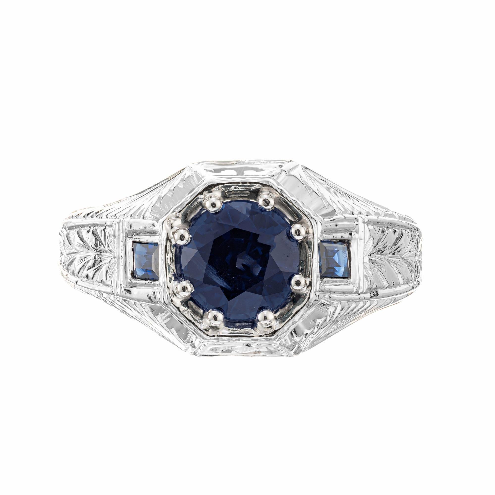 Vintage 1940's 20k white gold hand engraved men's natural sapphire ring. GIA certified simple heat only round blue sapphire in a 20k white gold setting with 2 step cut baguette sapphires.  

1 round blue sapphire, VS2 approx. 1.62cts. GIA certified#