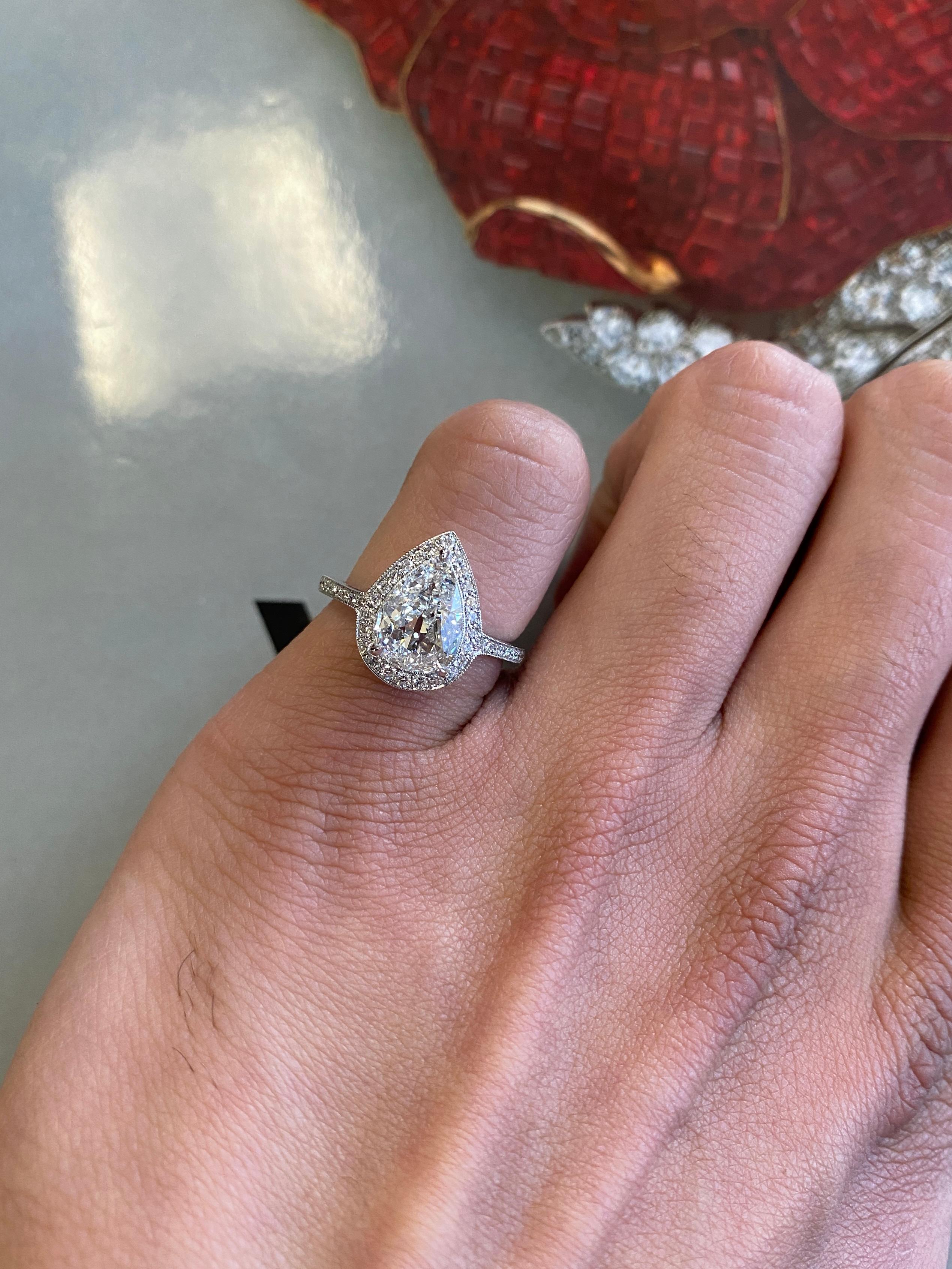 With its open culet and distinctive charm of an old stone, the stunning antique-cut pear shape in this ring is a testament to the craftsmanship and artistry of a bygone era, and highlights the unique beauty and character of antique diamonds. The