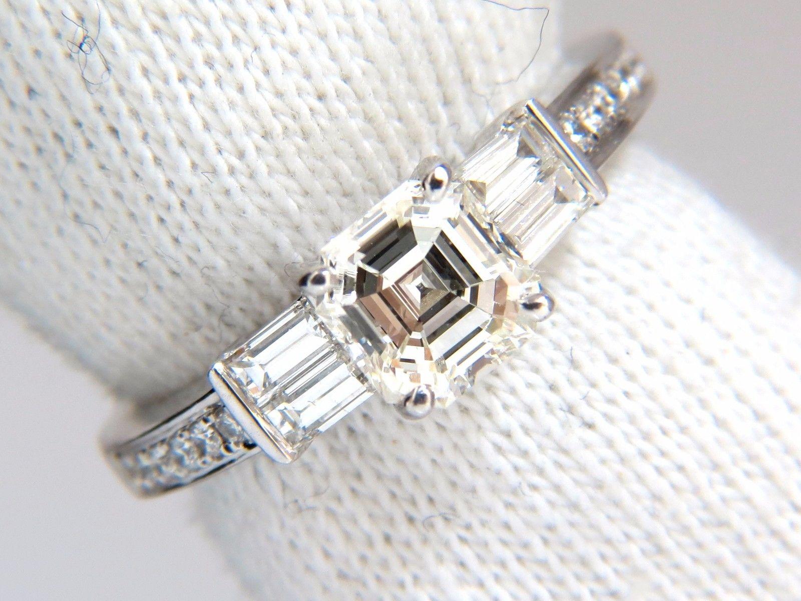 Traditional Asscher Prime

GIA Certified Diamond engagement ring.

1.12ct. Natural Asscher Cut diamond

GIA Certificate:  6167351406

J color VVs-2 clarity 

6.14 X 5.98 X 3.87mm

(Please see report copy attached)

.40ct Side baguette