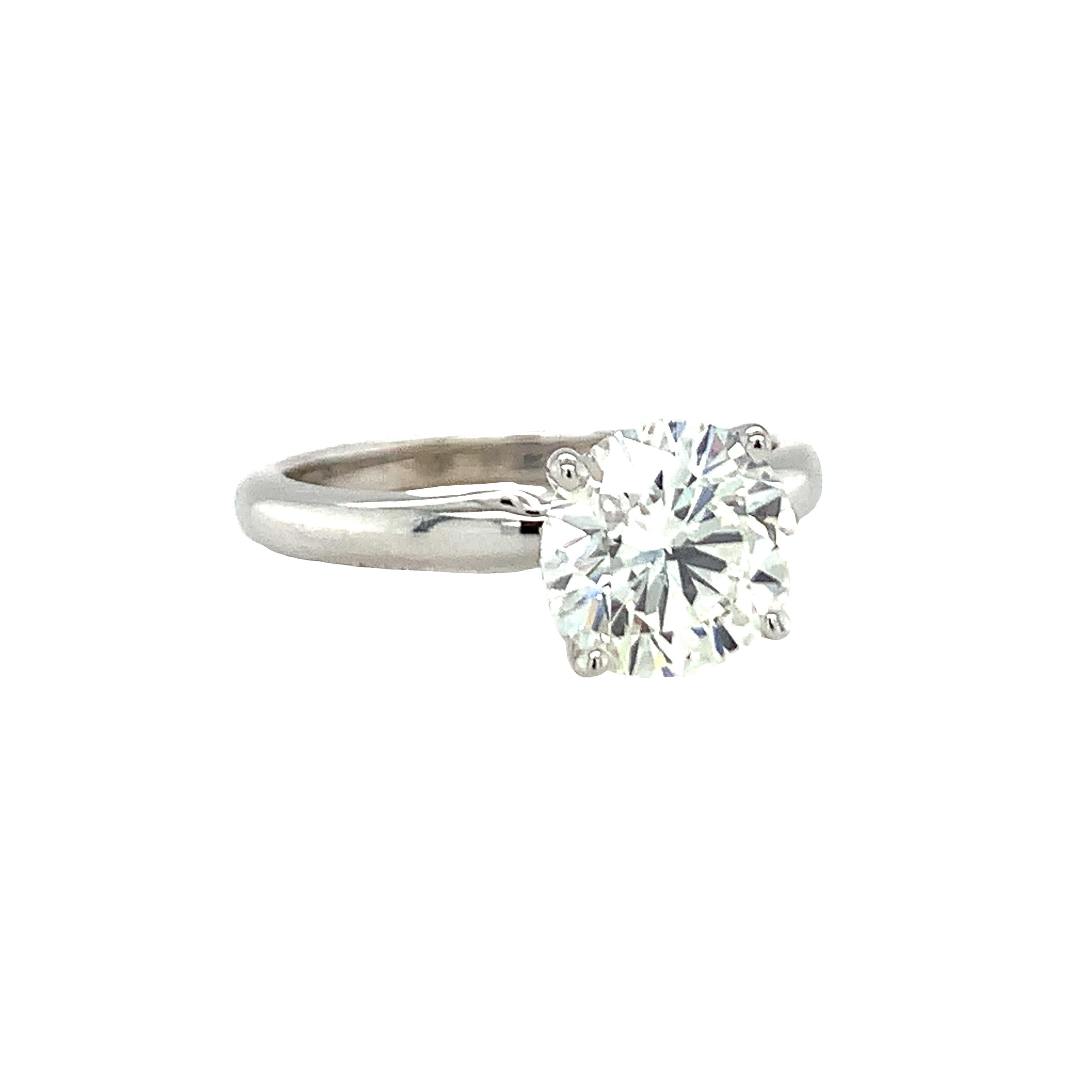 One GIA certified 1.63 ct. diamond engagement ring cast in 14K white gold centering one prong set, round brilliant cut diamond with J color and SI-2 clarity with excellent cut grade and laser inscribed accompanied by GIA Report.

Stunning,