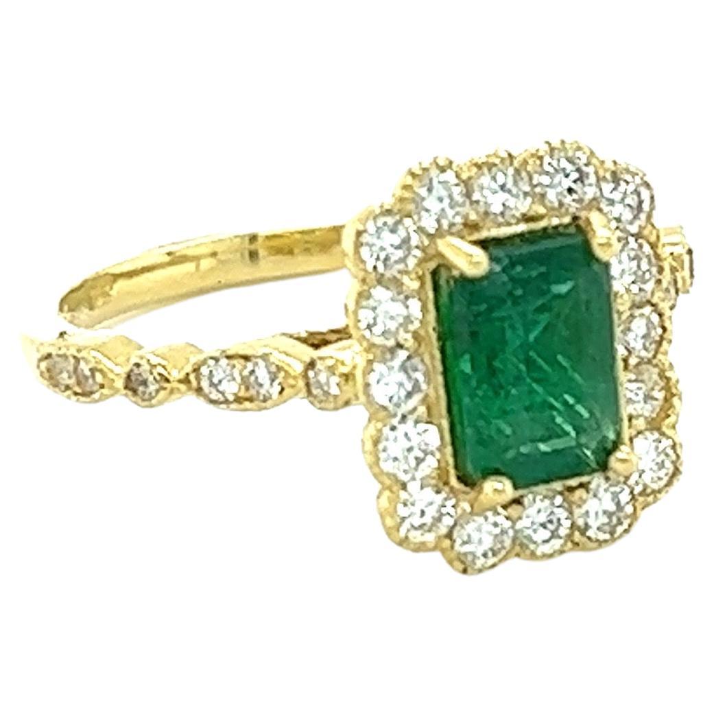 The Emerald Cut Natural Emerald weighs 1.03 carats and measures at 7 mm x 5 mm and is surrounded by Natural Round Cut Diamonds that weigh 0.60 carats with a clarity & color of SI1-F.  The total carat weight of the ring is 1.63 carats.

The Emerald