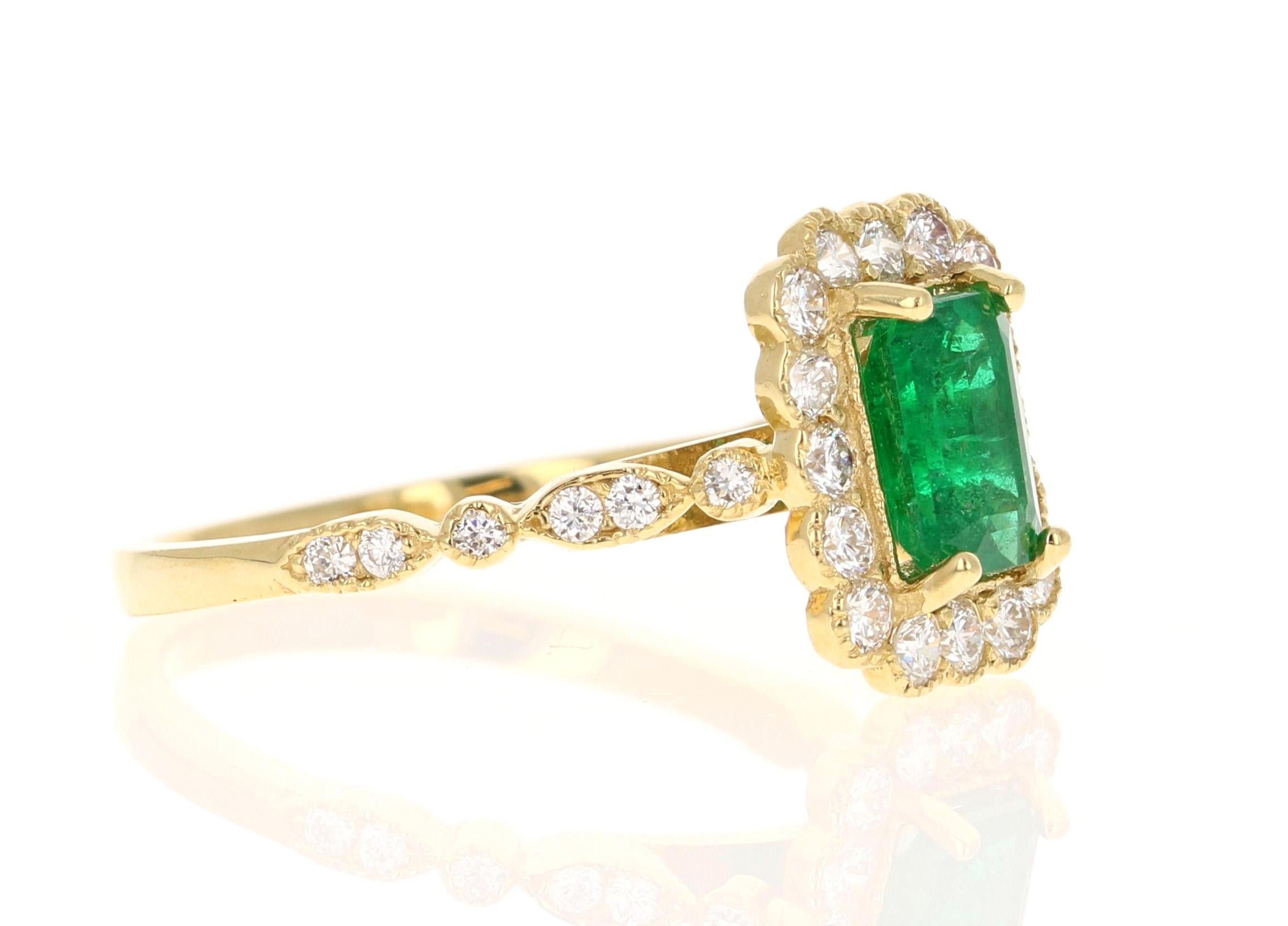 The Emerald Cut Natural Emerald weighs 1.03 carats and measures at 7 mm x 5 mm and is surrounded by Natural Round Cut Diamonds that weigh 0.60 carats with a clarity & color of SI1-F.  The total carat weight of the ring is 1.63 carats.

The Emerald