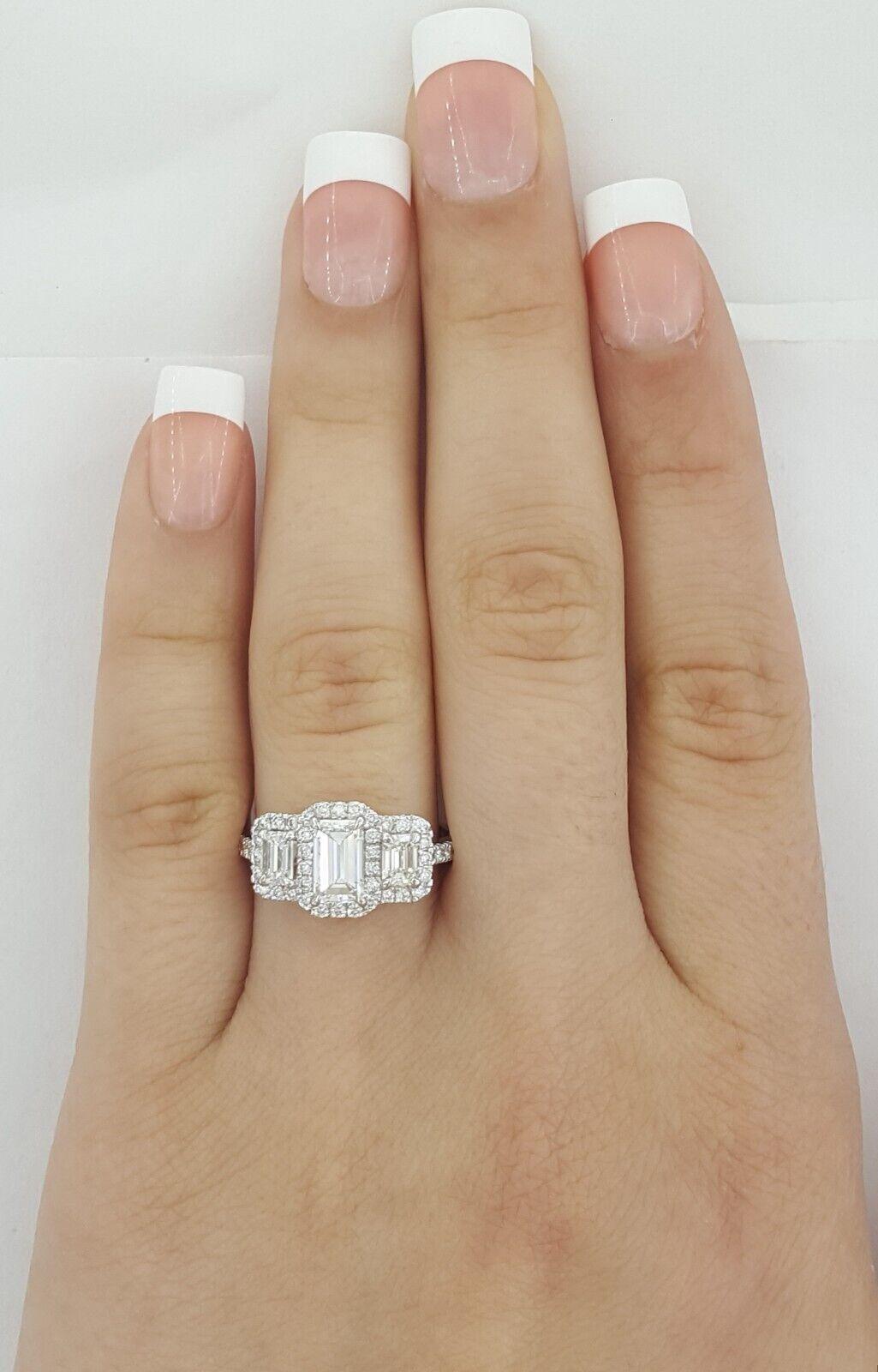 Contemporary GIA Certified 1.63 Carat Total Weight Three-Stone Emerald Cut Diamond Halo Ring For Sale