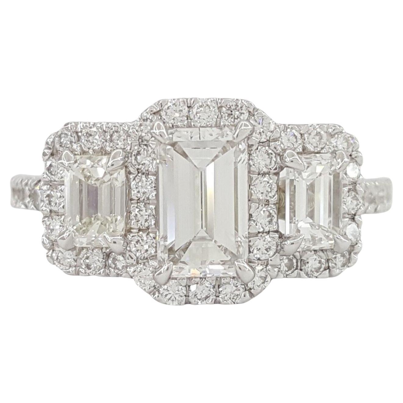 GIA Certified 1.63 Carat Total Weight Three-Stone Emerald Cut Diamond Halo Ring For Sale