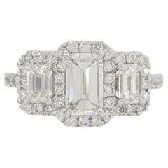 GIA Certified 1.63 Carat Total Weight Three-Stone Emerald Cut Diamond Halo Ring