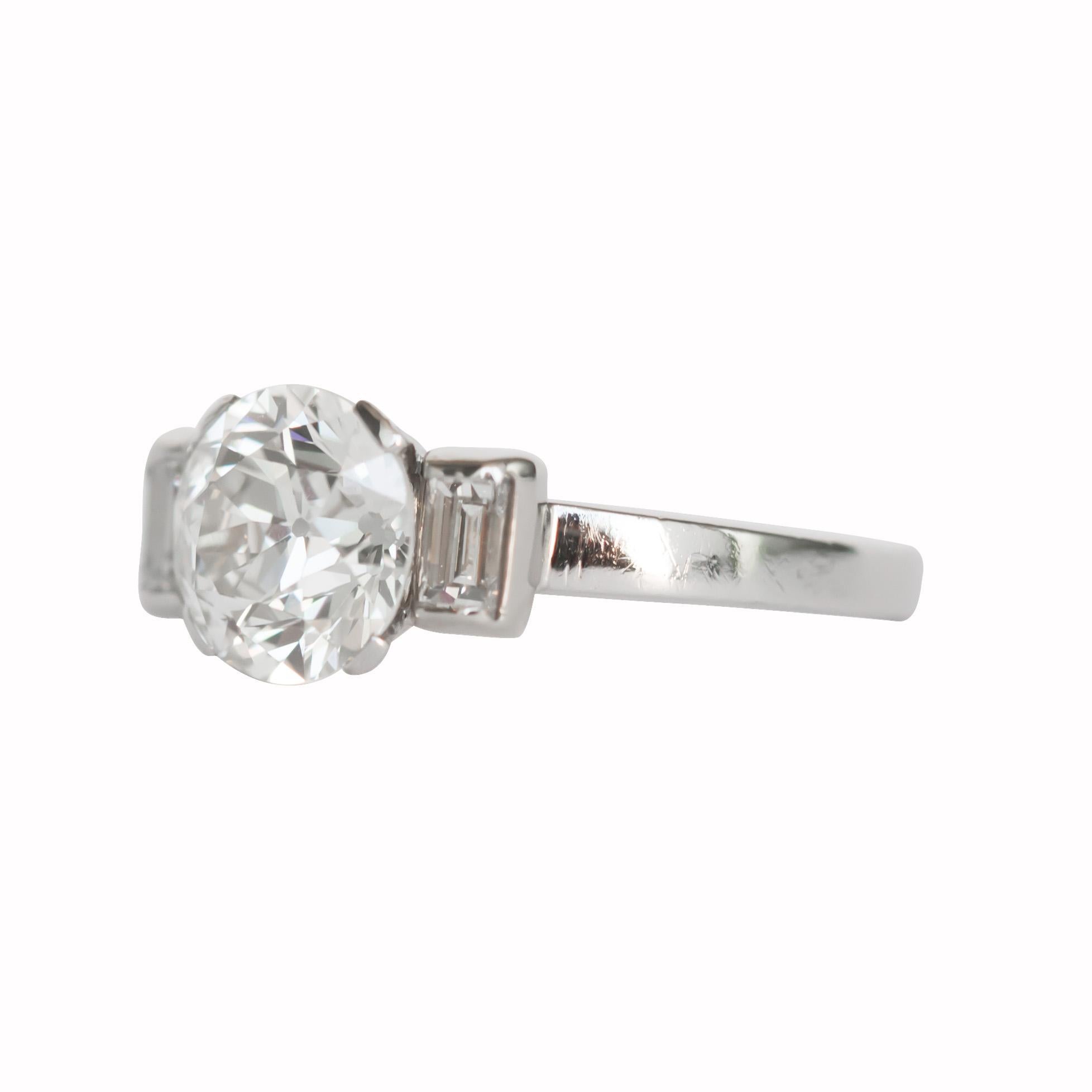 Item Details: 
Ring Size: 5.5
Metal Type: Platinum [Hallmarked, and Tested]
Weight: 4.8 grams

Center Diamond Details:
GIA REPORT # 2203692183
Weight: 1.64 carat
Cut: Old European Brilliant
Color: J
Clarity: VS1

Side Diamond Details:
Weight: .25