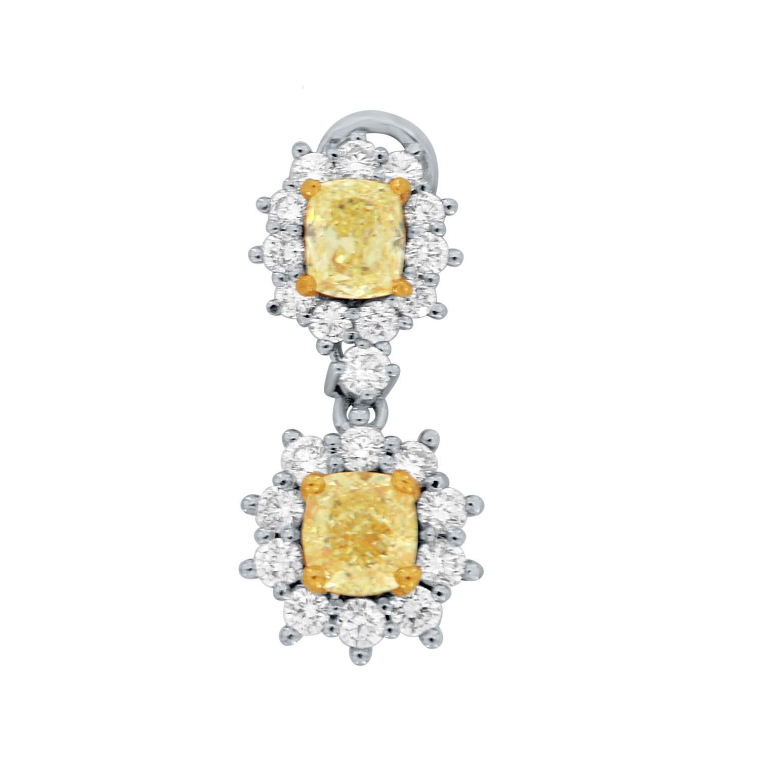 These stunning drop earrings feature four (4) Cushion shape Natural Yellow diamonds in a total weight of 1.65 carats encircled by brilliant round diamonds prong-set in a total weight of 0.79 carats. 
The earrings are 20 mm long and 9 mm wide french