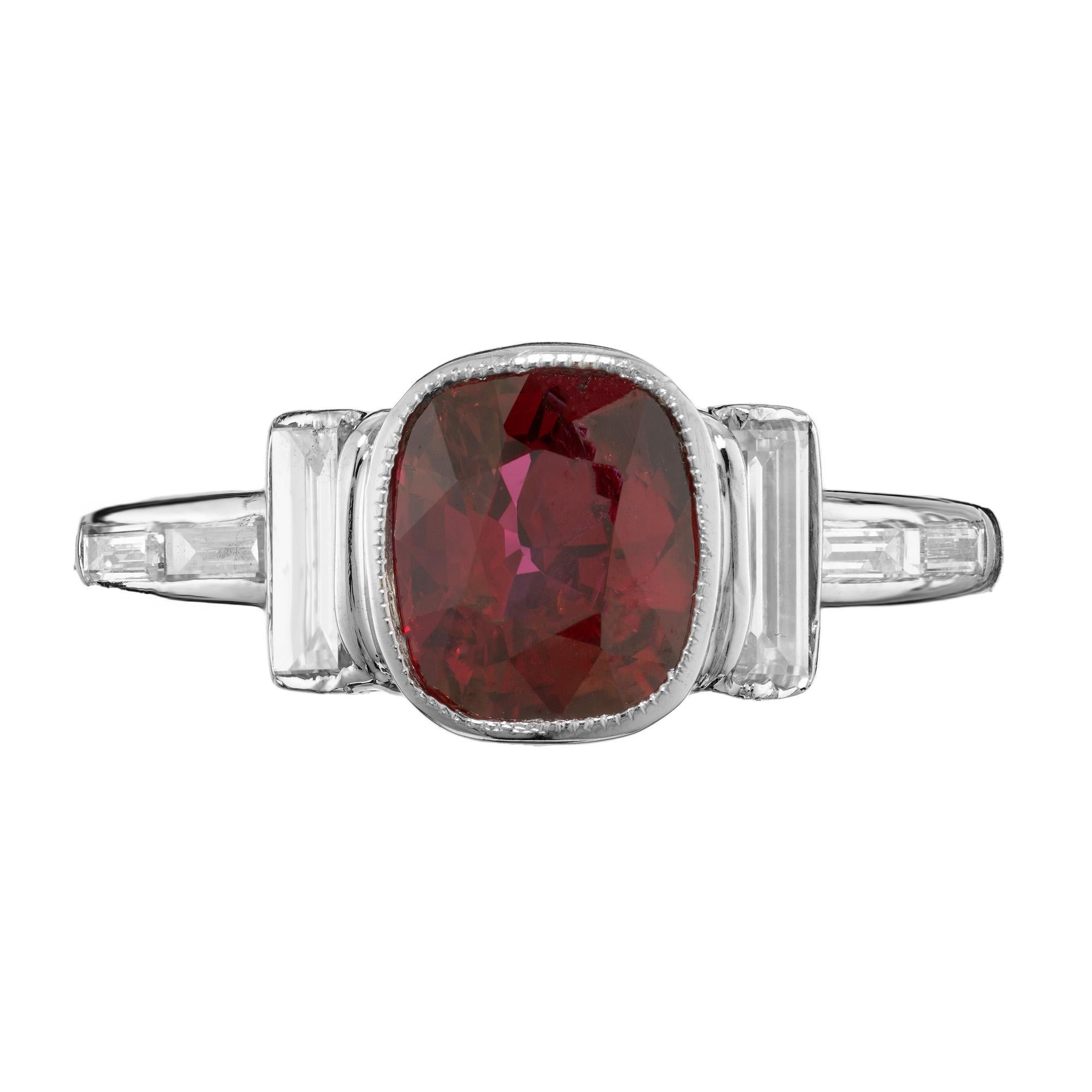 1920's Art Deco cushion cut Ruby and white diamond engagement ring. Cushion cut bezel set 1.66ct ruby mounted in a platinum setting with two baguette cut side diamonds. Two side set baguettes diamonds adorn each shoulder. The has GIA certified the